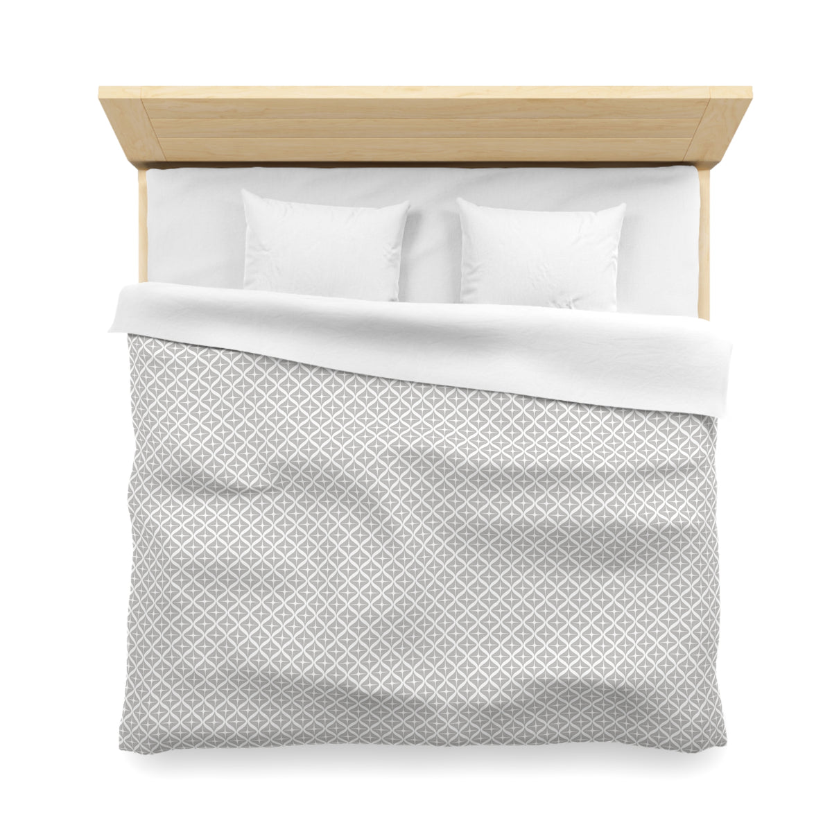 A neatly made bed with a white comforter and pillows, set against a plain white background.