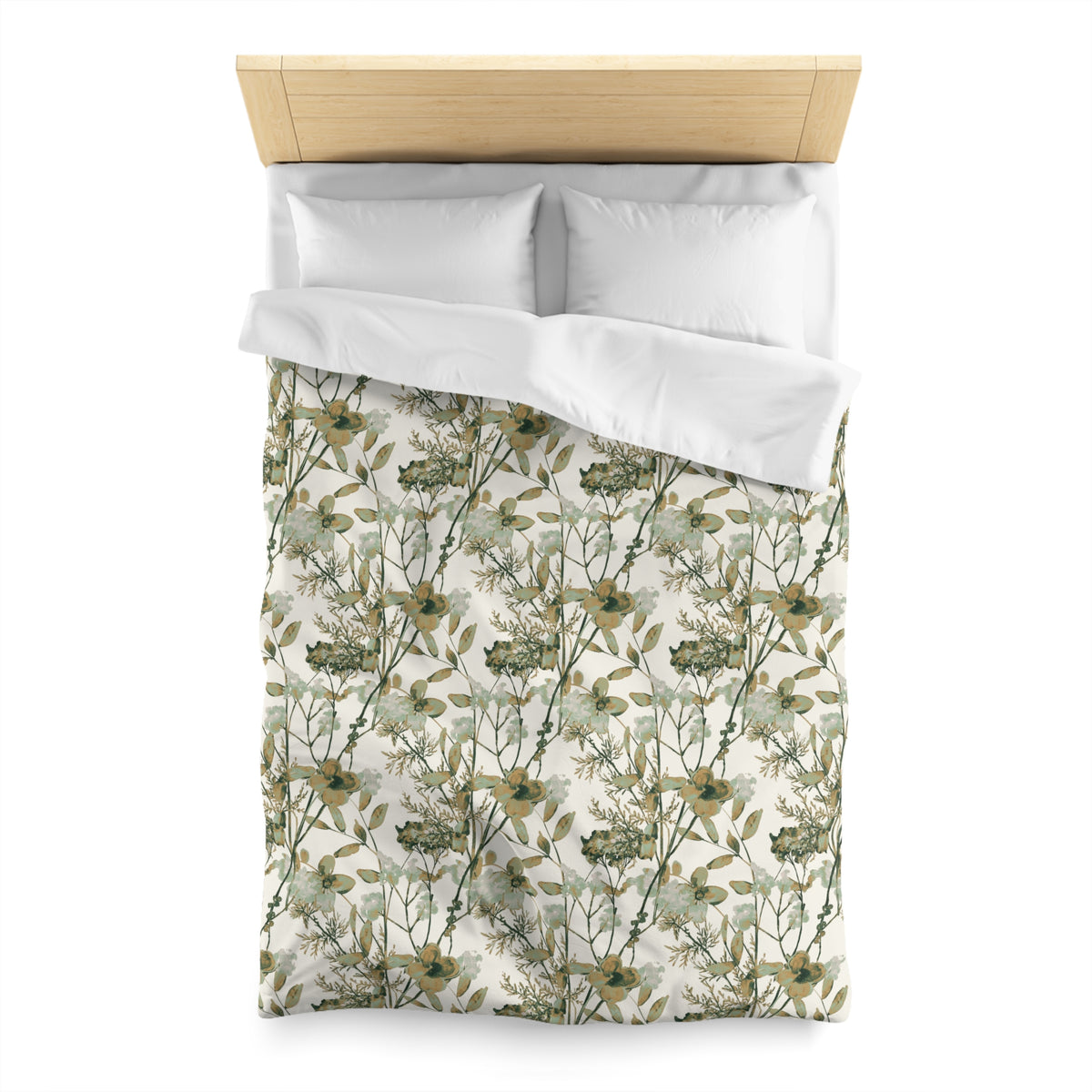 a neatly made bed with a floral print duvet cover and two white pillows.