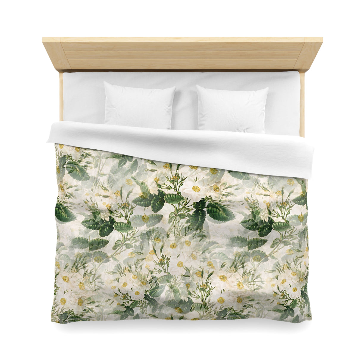 a neatly made bed with a floral print duvet cover and two white pillows.