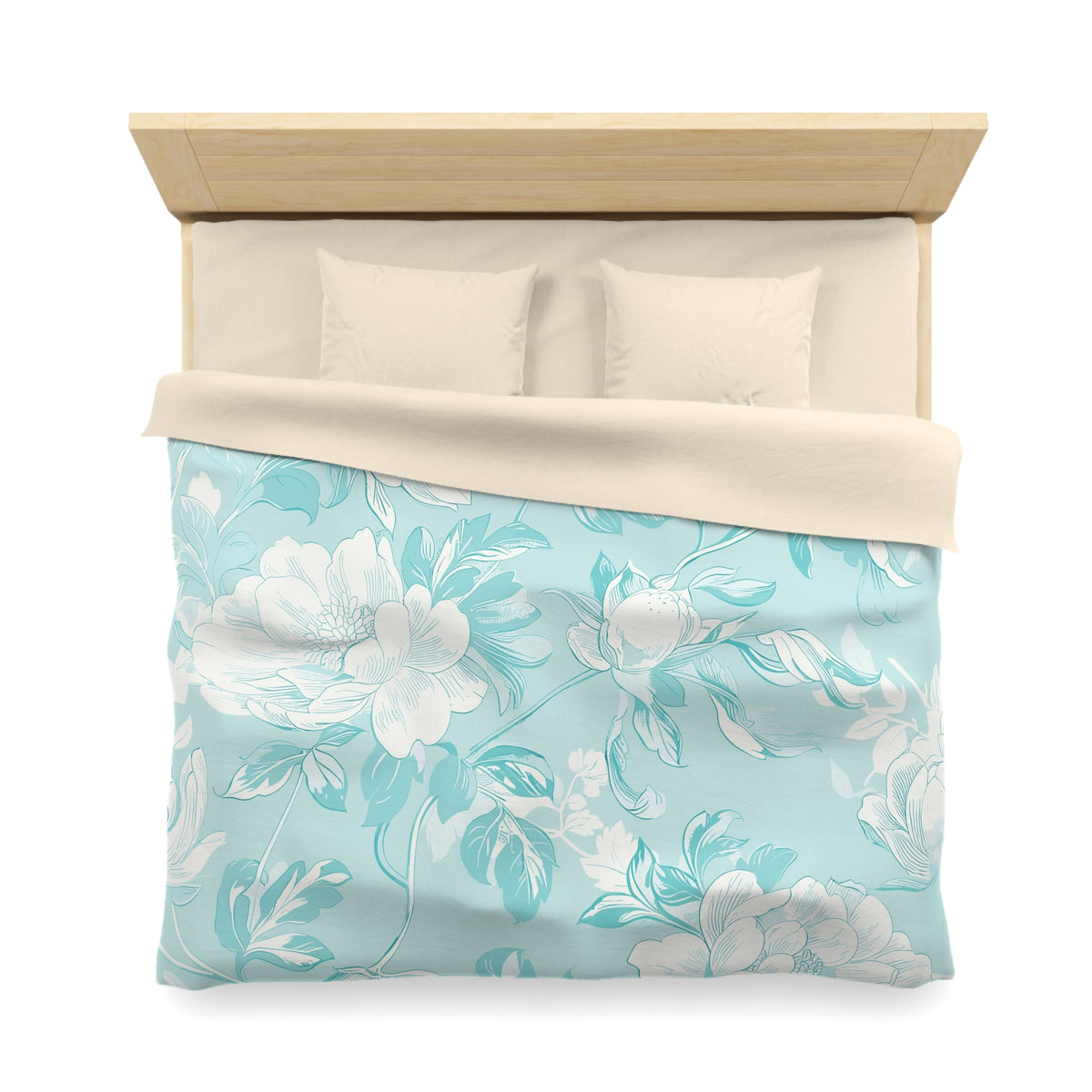 a neatly made bed with a floral patterned comforter and pillows.