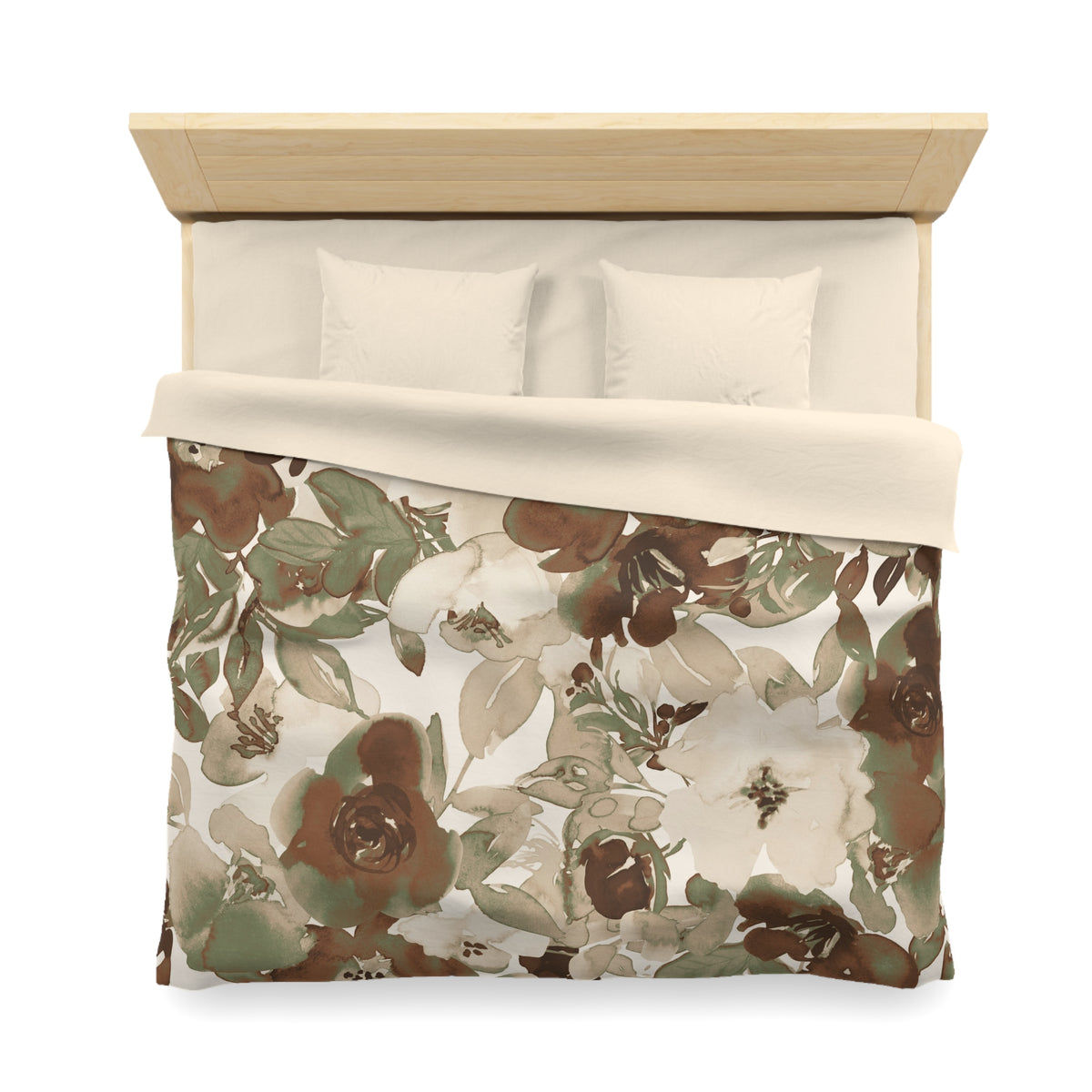 a neatly made bed with a floral print comforter and two pillows.