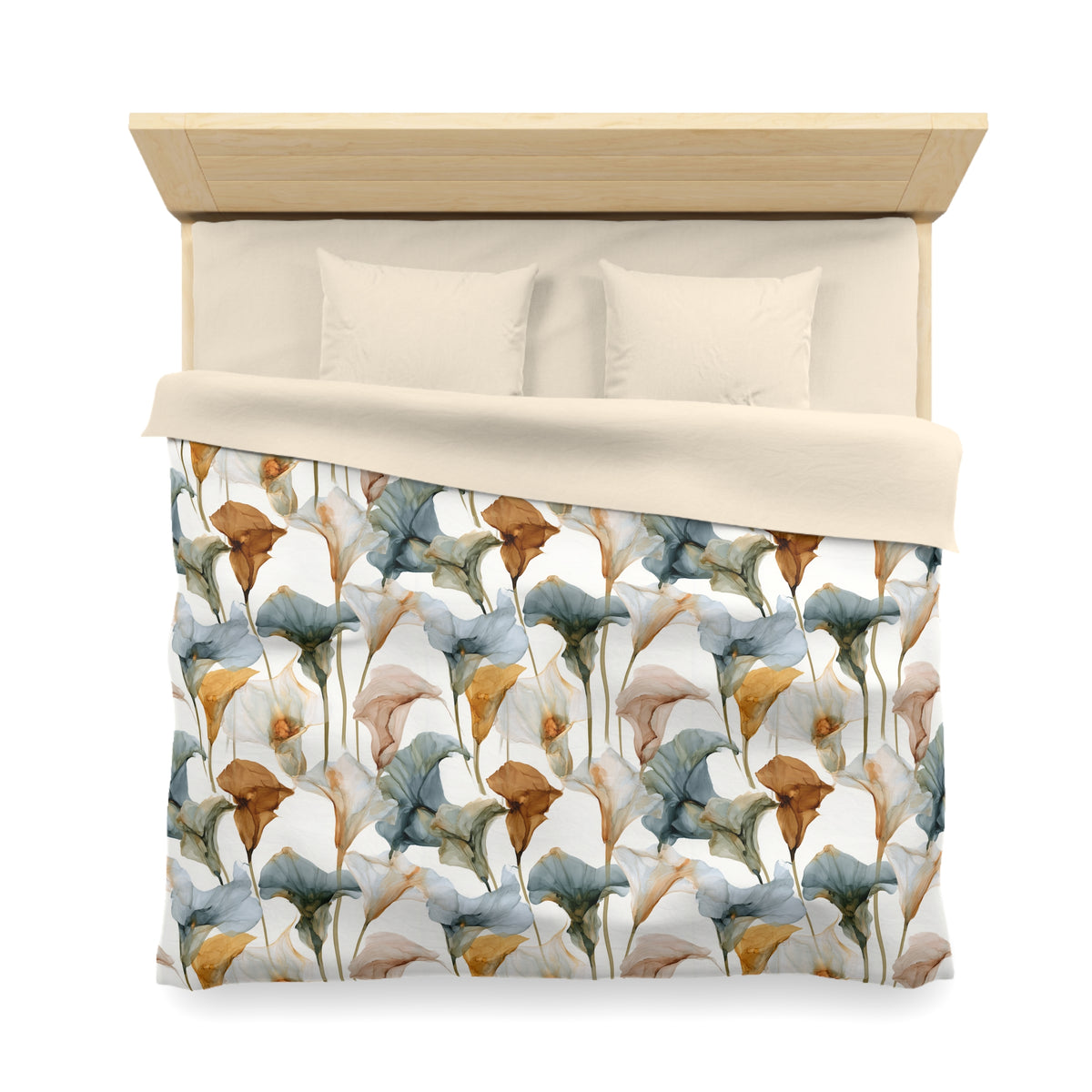 a bed with a floral patterned comforter and pillows.
