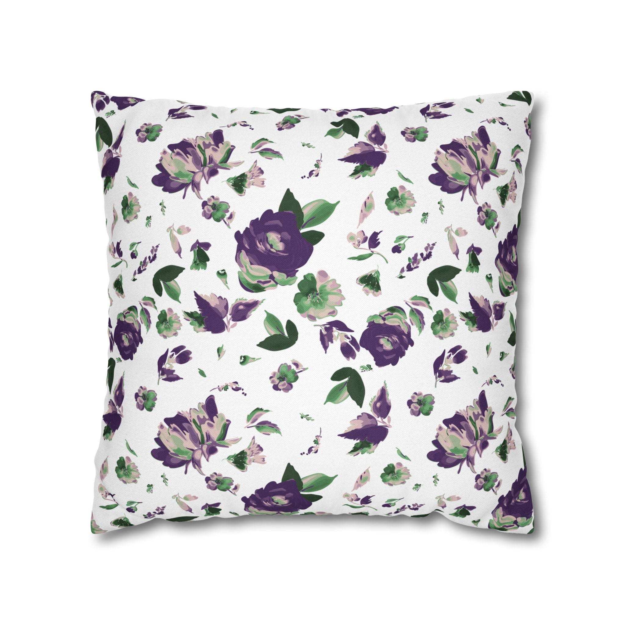 a square pillow with a floral pattern in shades of purple and green.