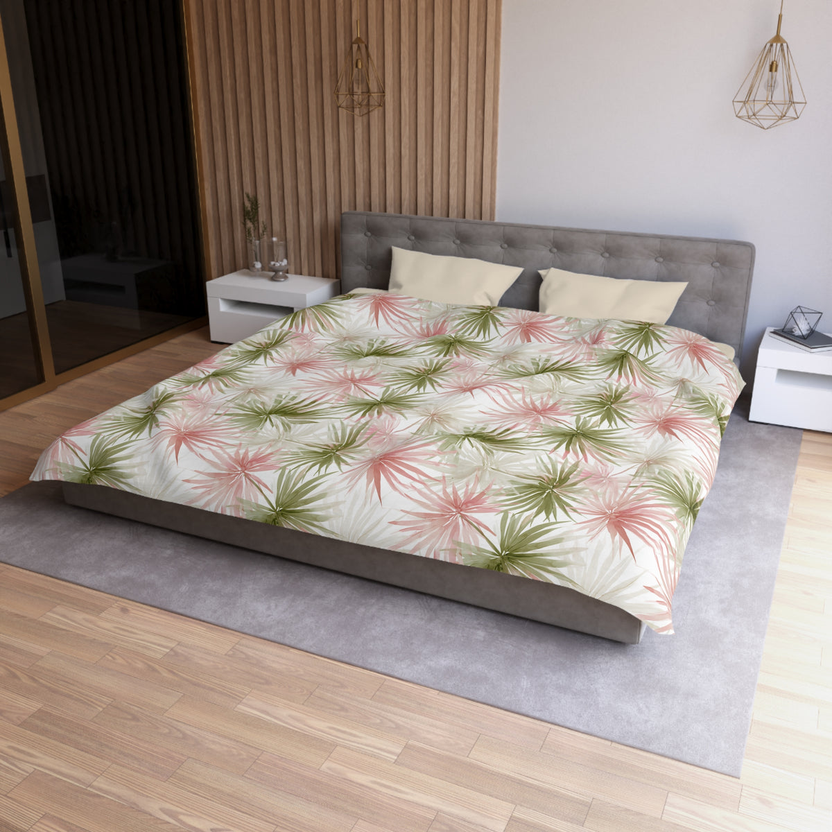 a modern bedroom with a large bed, a gray headboard, and a green and white floral comforter. The room has a wooden floor and white walls, creating a serene and stylish atmosphere.