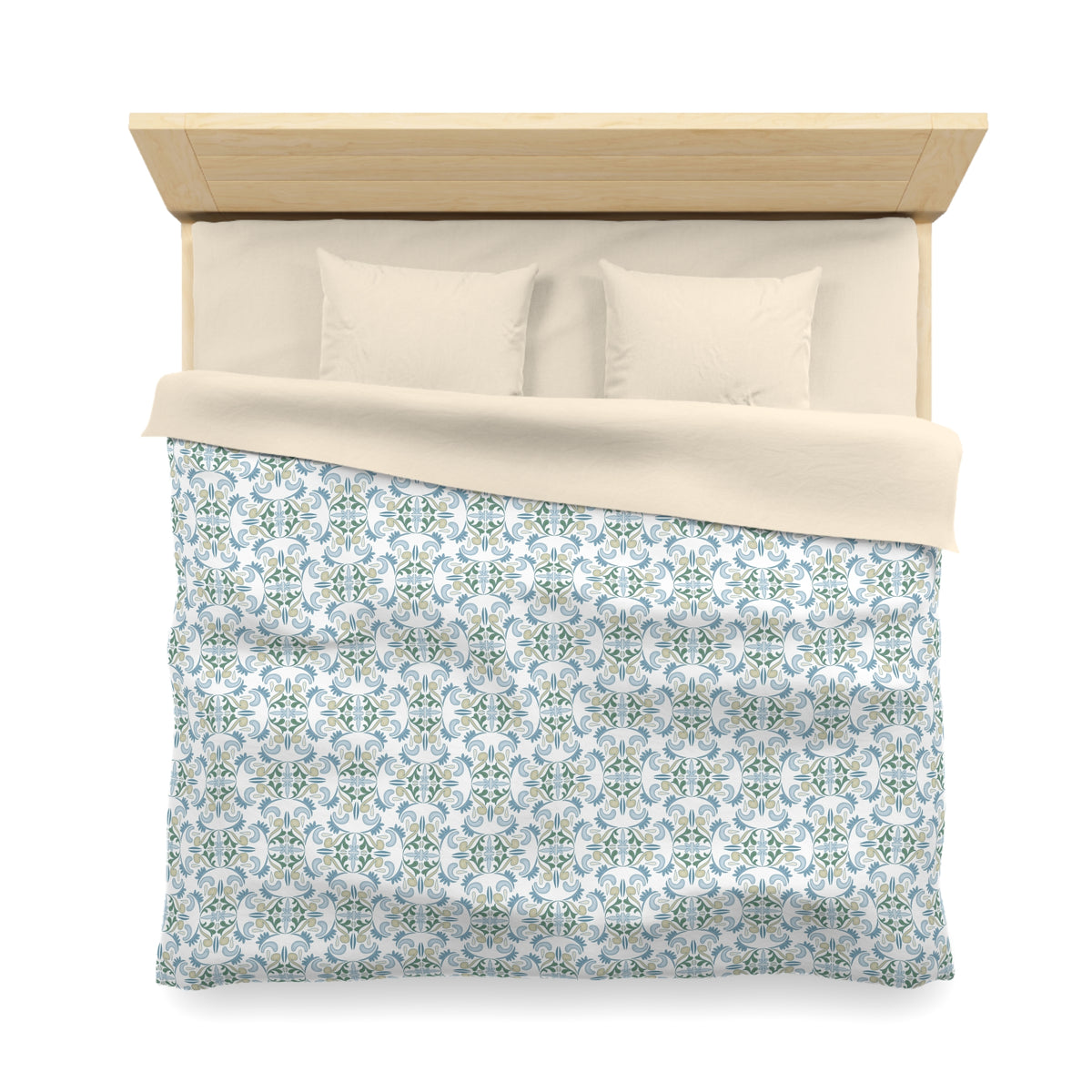 a neatly made bed with a patterned comforter and pillows.