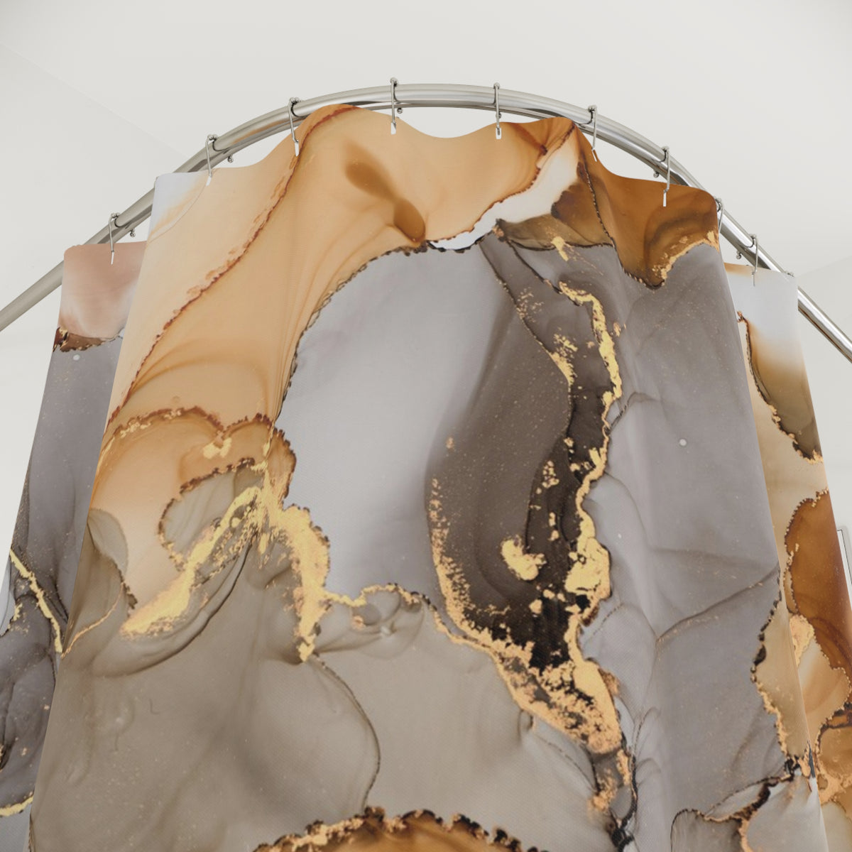 a shower curtain with a marble-like pattern in shades of brown and gray, with gold accents.