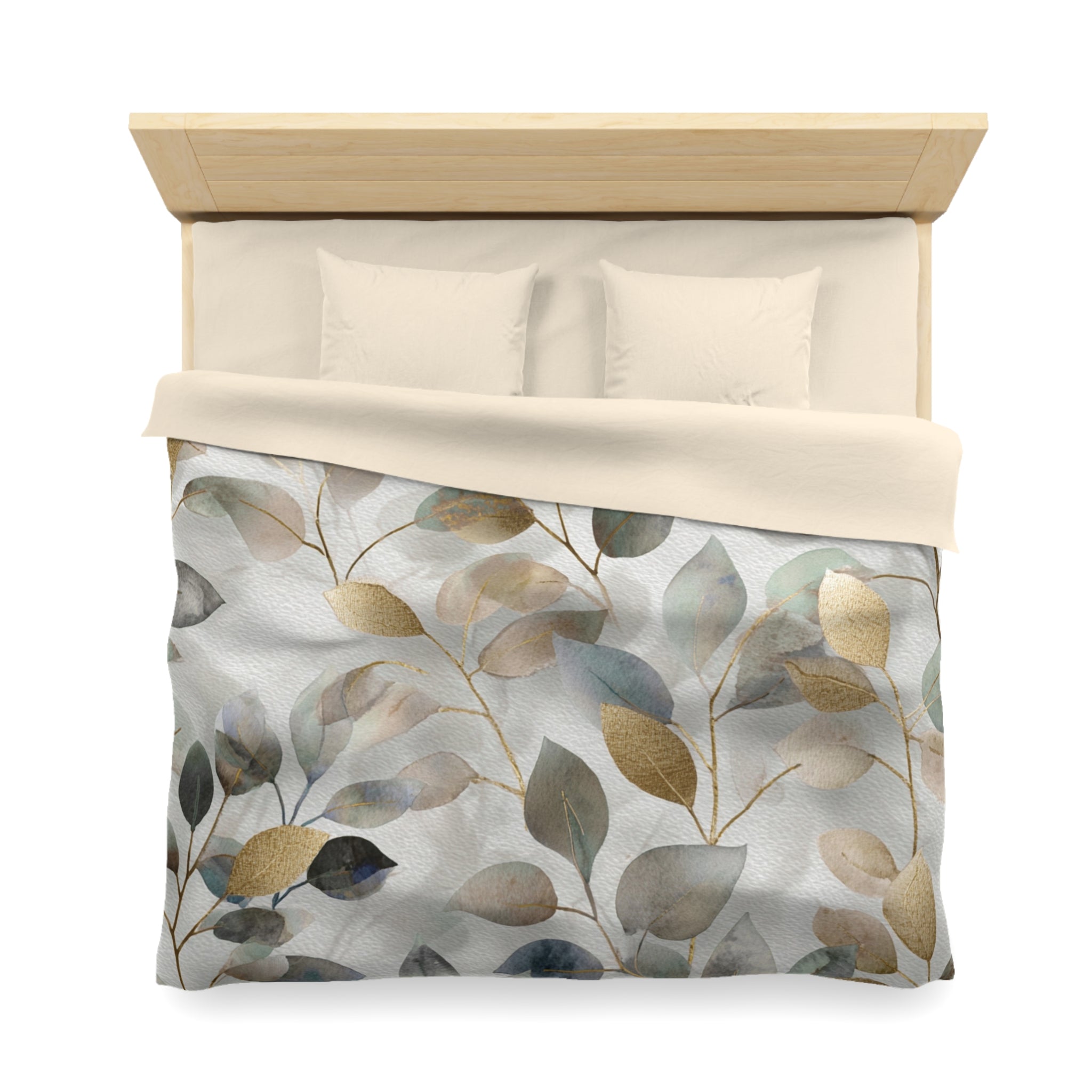 a neatly made bed with a white comforter and a patterned duvet cover featuring a leaf design in shades of green, gray, and beige.