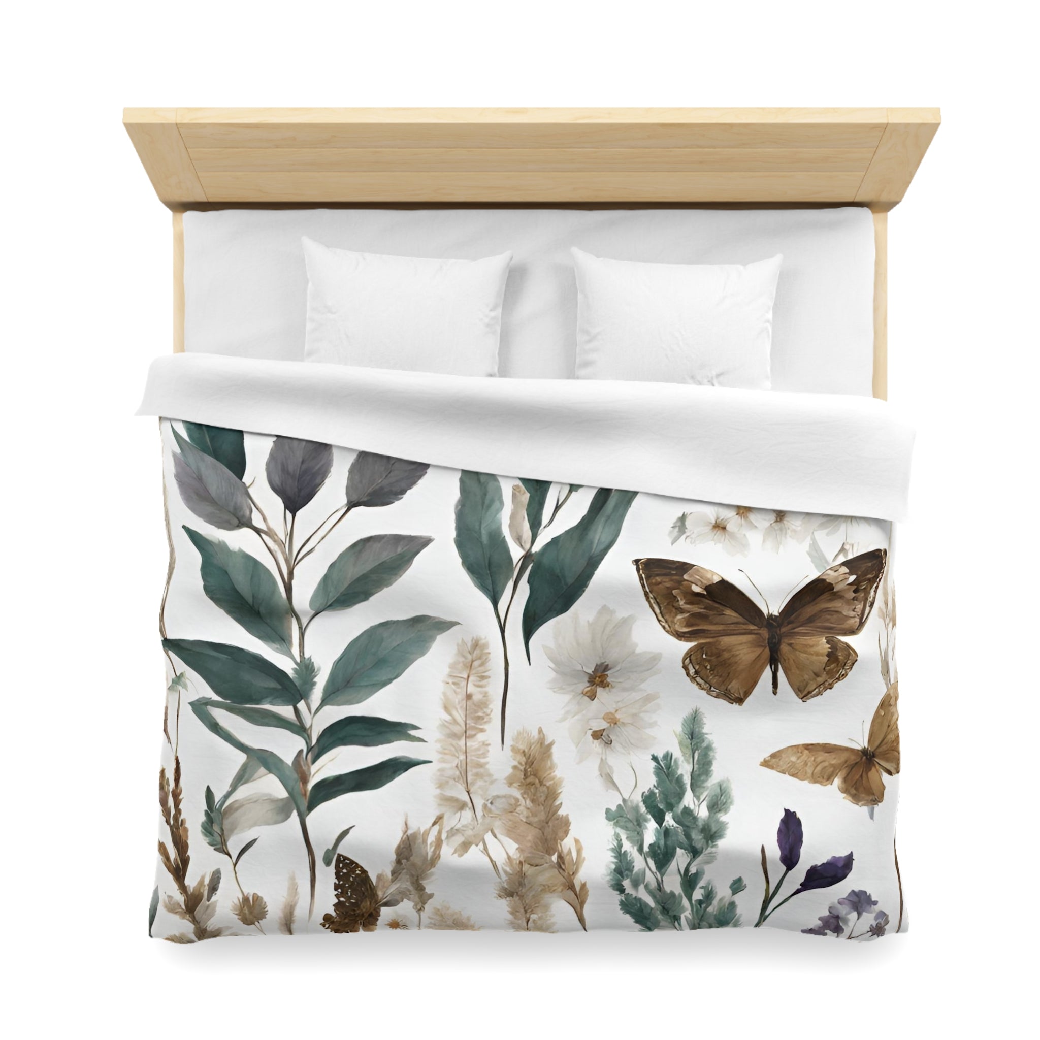 a bed with a white comforter and a printed design featuring various plants and butterflies.