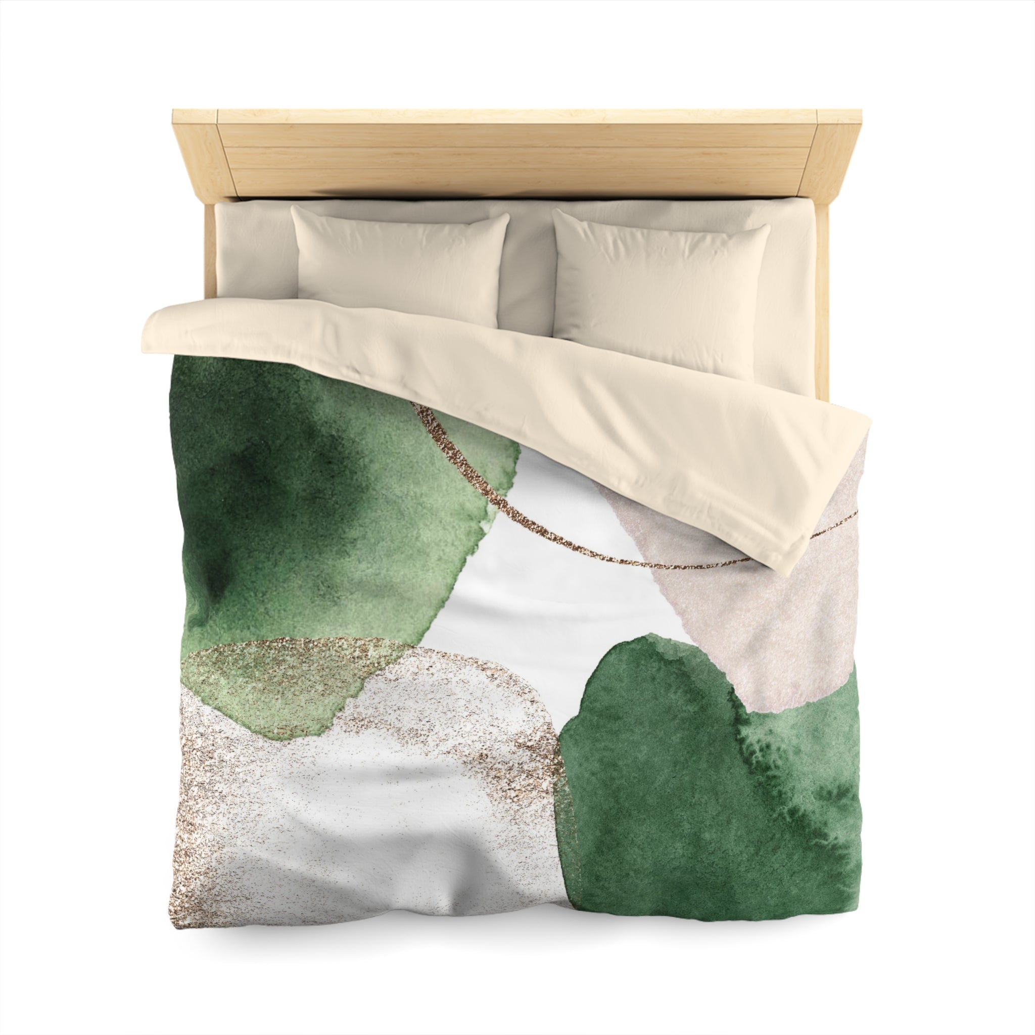 a bed with a green and white abstract patterned comforter and pillows.