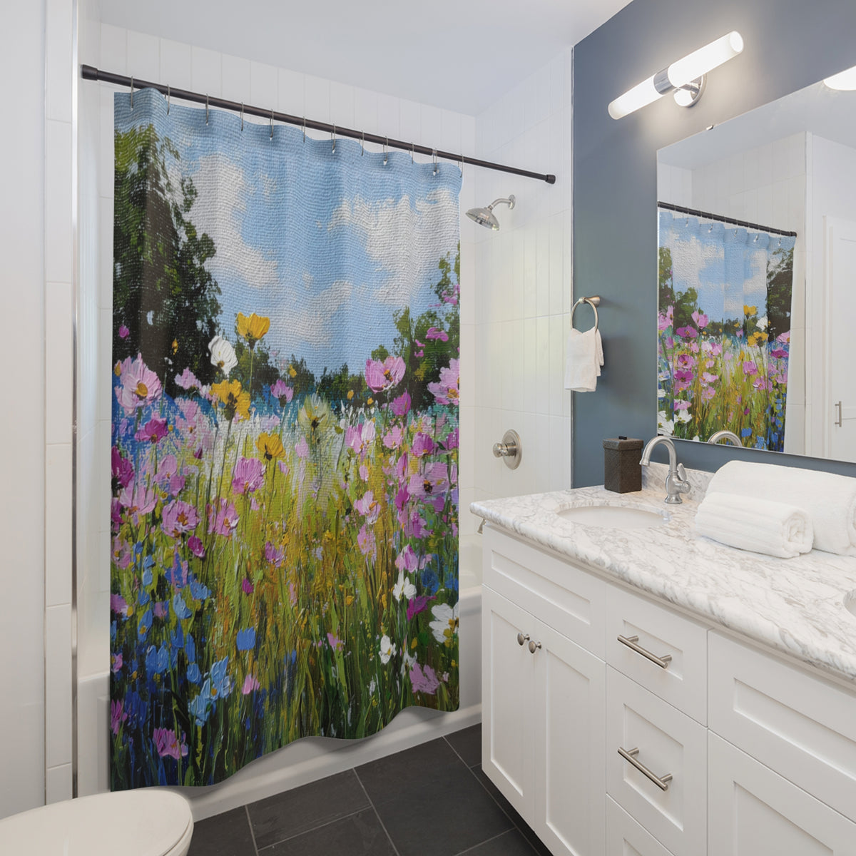 A bathroom with a shower curtain featuring a colorful floral pattern.