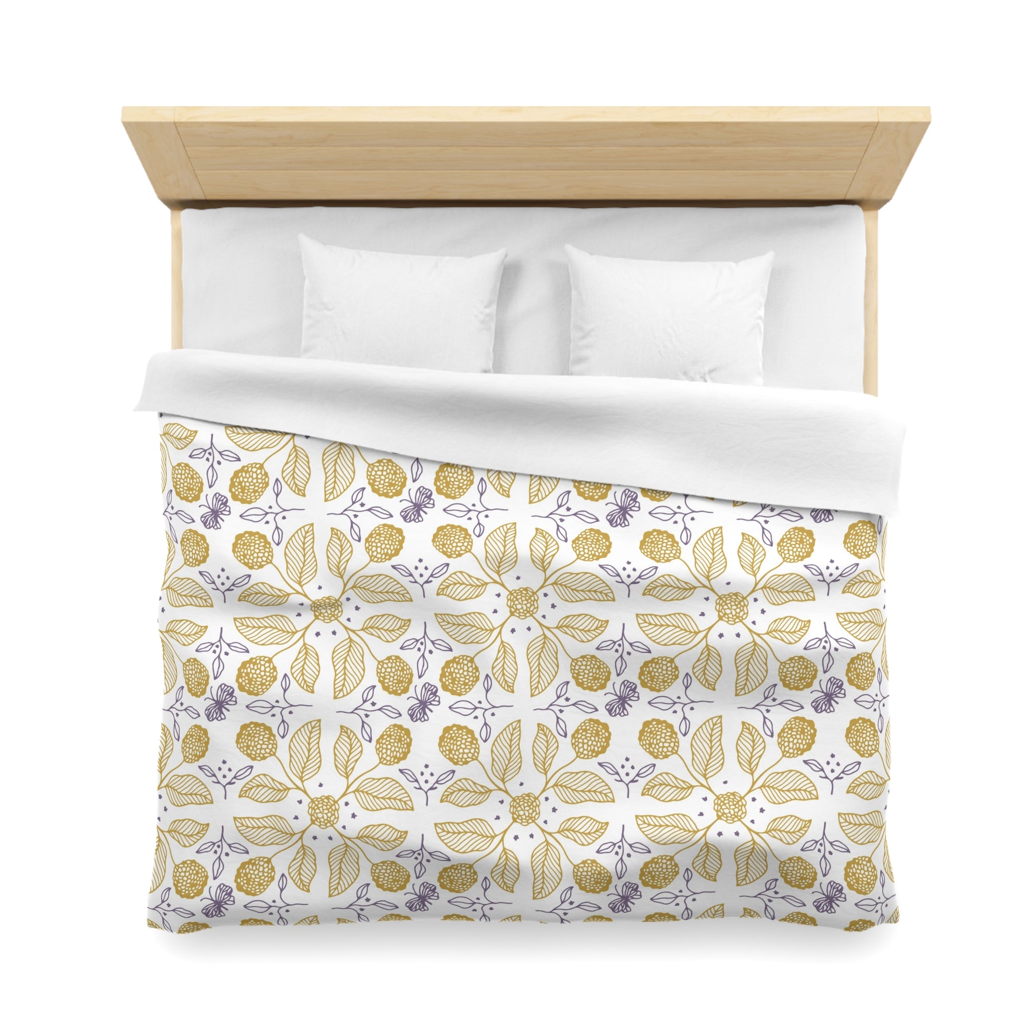 a neatly made bed with a white comforter and a patterned duvet cover featuring a floral design in shades of yellow and purple.