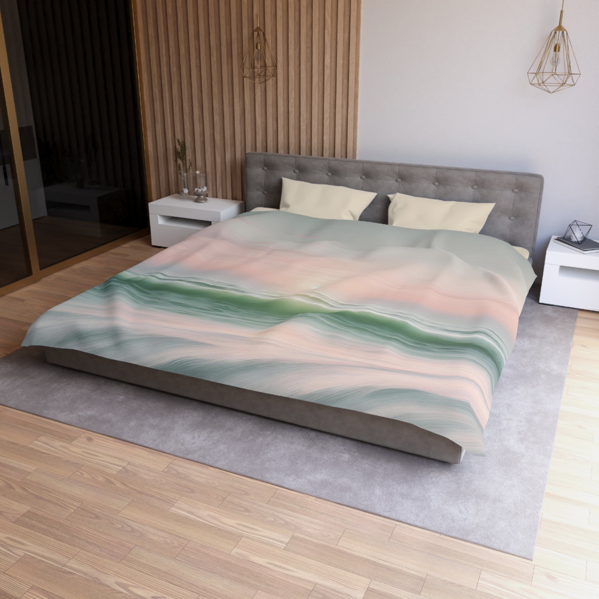 a modern bedroom with a large bed, a gray headboard, and a colorful abstract patterned bedspread. The room has a wooden floor and white walls, creating a clean and minimalist aesthetic.