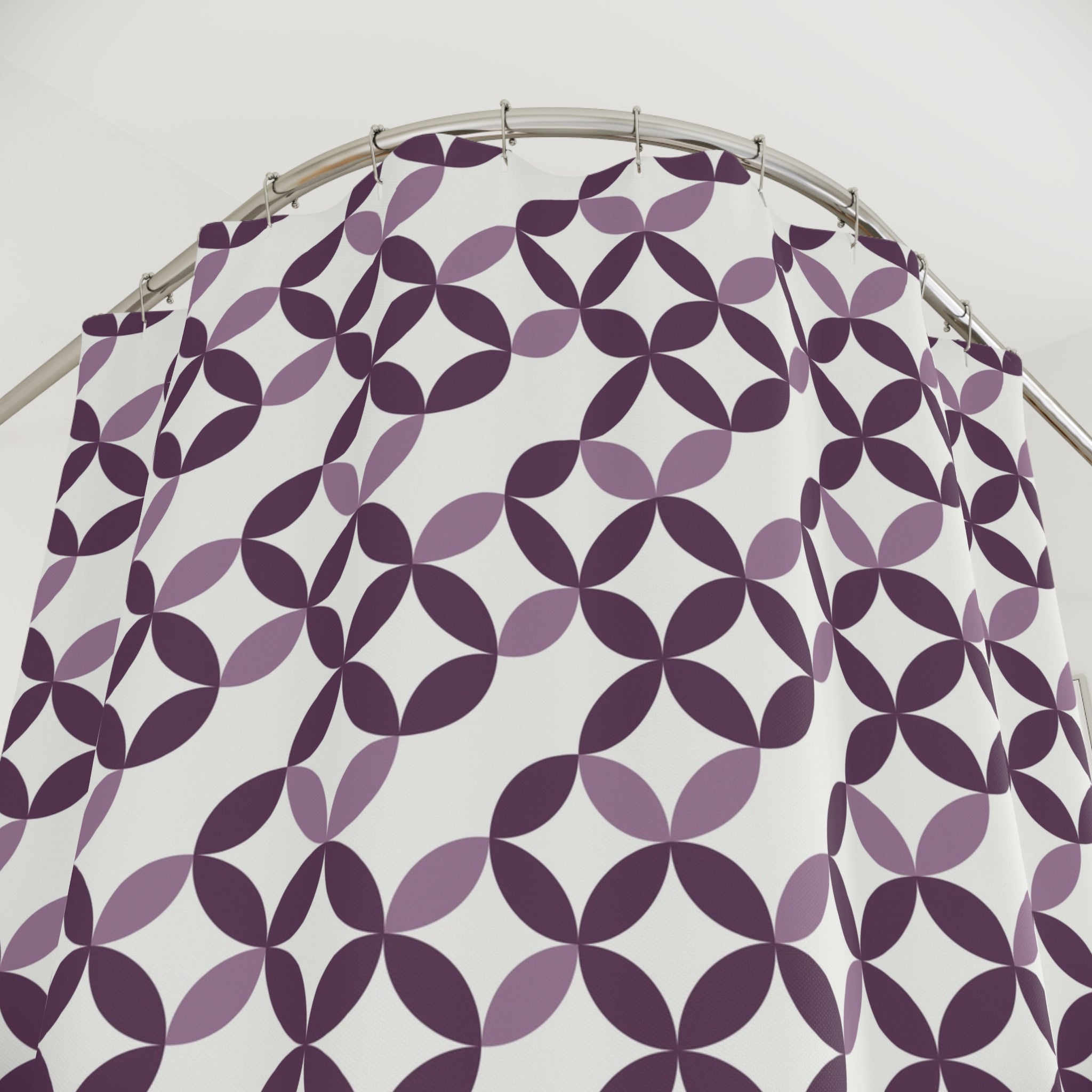 a shower curtain with a repeating pattern of purple and white circles on a white background.