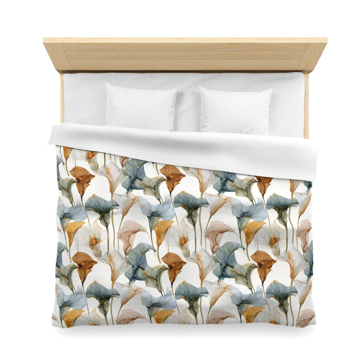 a bed with a floral patterned comforter and pillows.