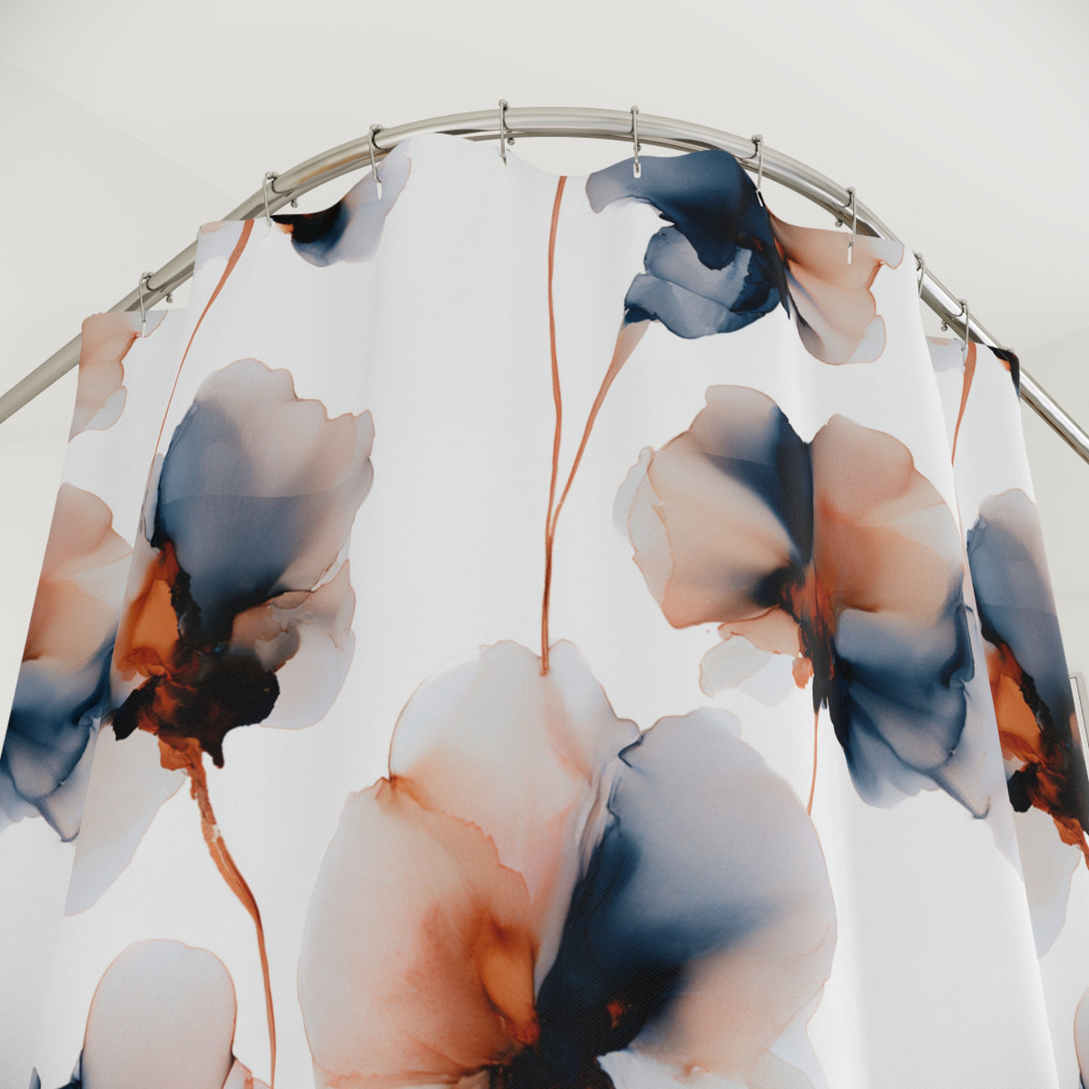 a shower curtain with a floral pattern in shades of blue, orange, and white.