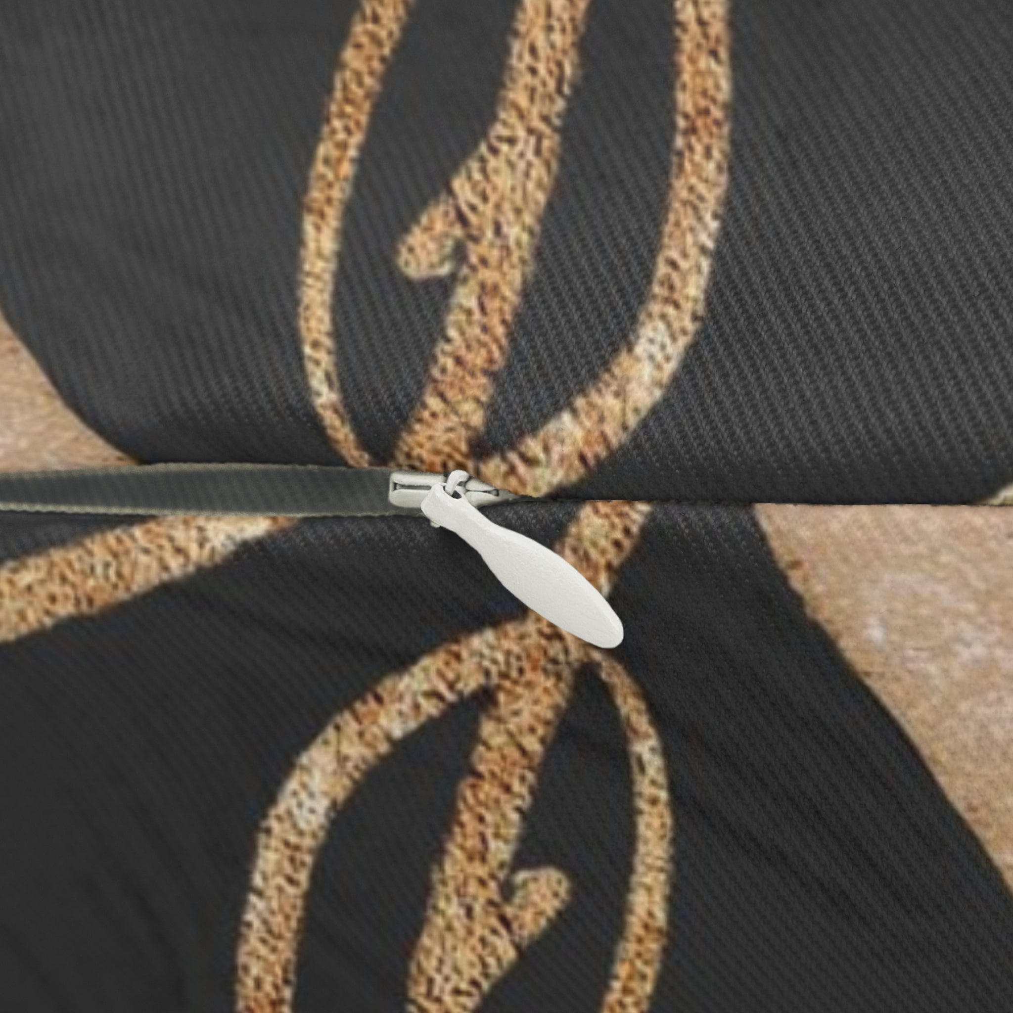 Black, white and beige abstract boho lumbar pillow styled on a sofa