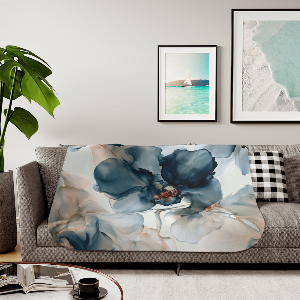 a living room with a couch, coffee table and pictures on the wall