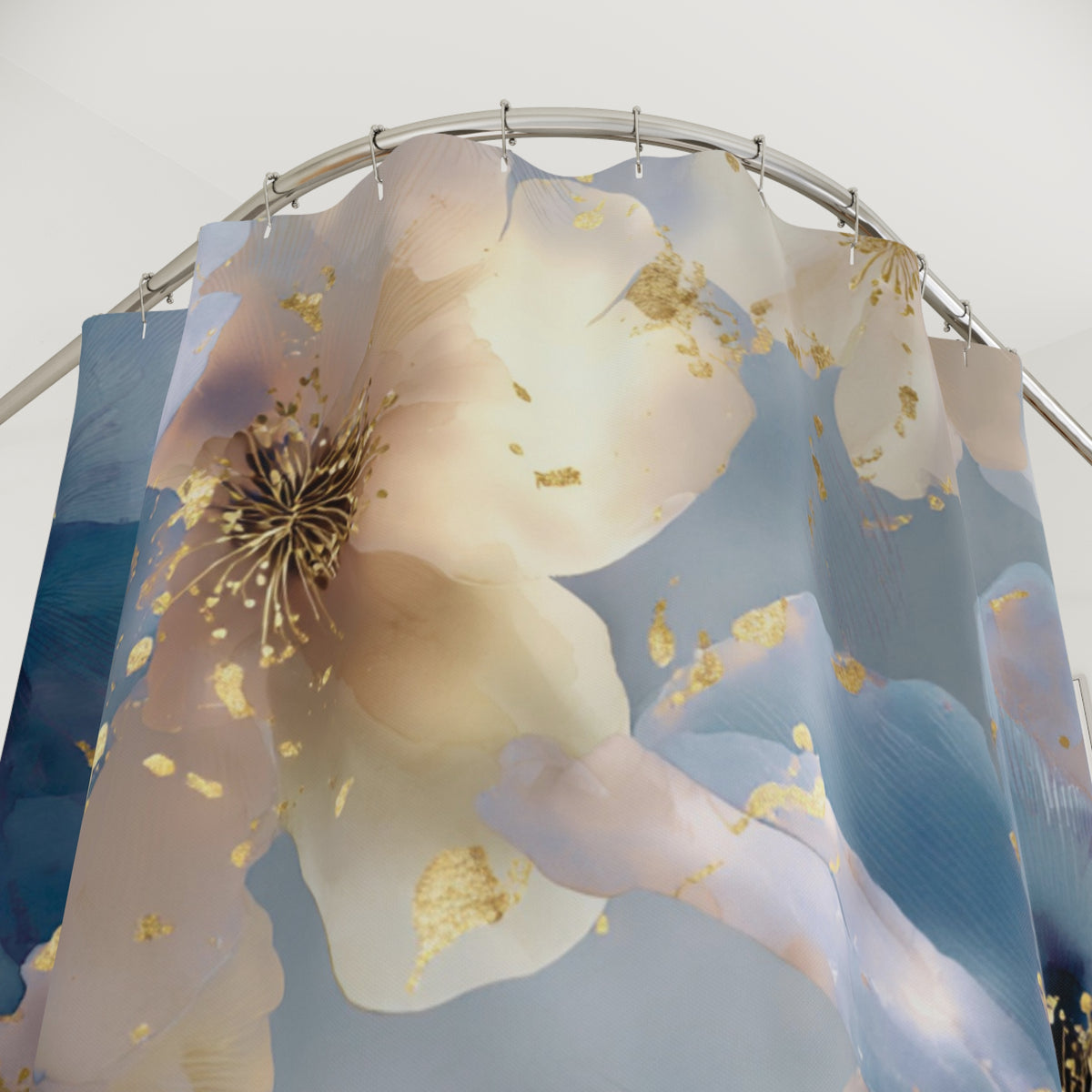 a shower curtain with a floral pattern, including a large white flower with gold accents and smaller flowers in shades of blue and pink.