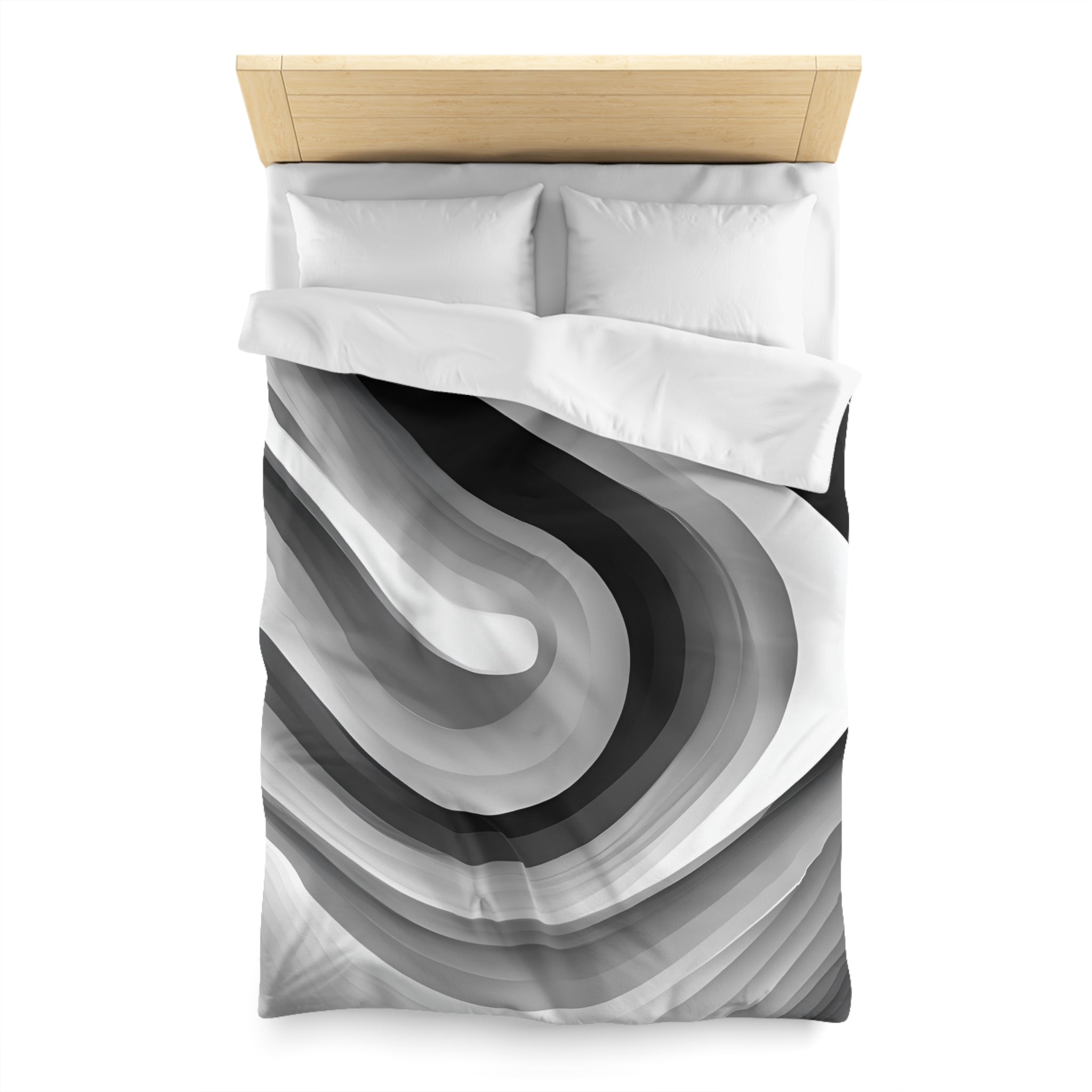 a bed with a black and white abstract design on the comforter and pillows.