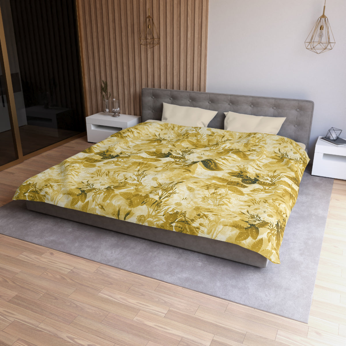 a modern bedroom with a large bed, a gray headboard, and a yellow and green floral comforter. The room has a wooden floor and white nightstands on either side of the bed.