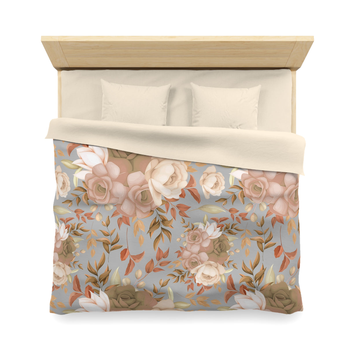 a bed with a floral print comforter and pillows.