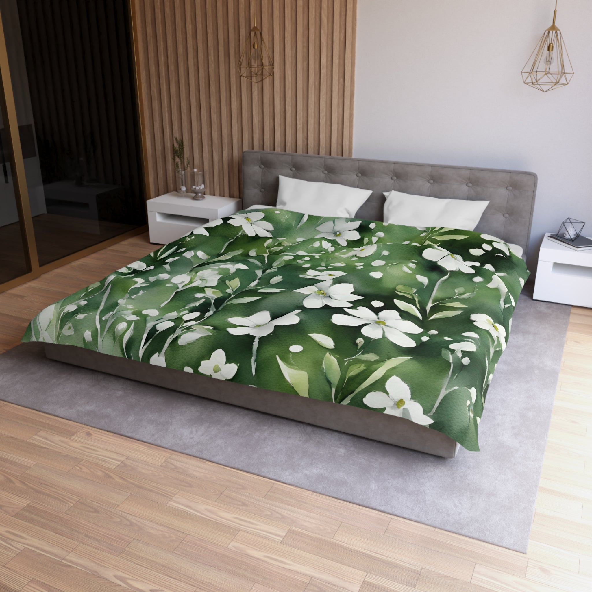 a modern bedroom with a large bed covered in a green and white floral comforter. The bed is positioned against a wall with a wooden paneling. The room also features a nightstand, a pendant light, and a vase on a surface.