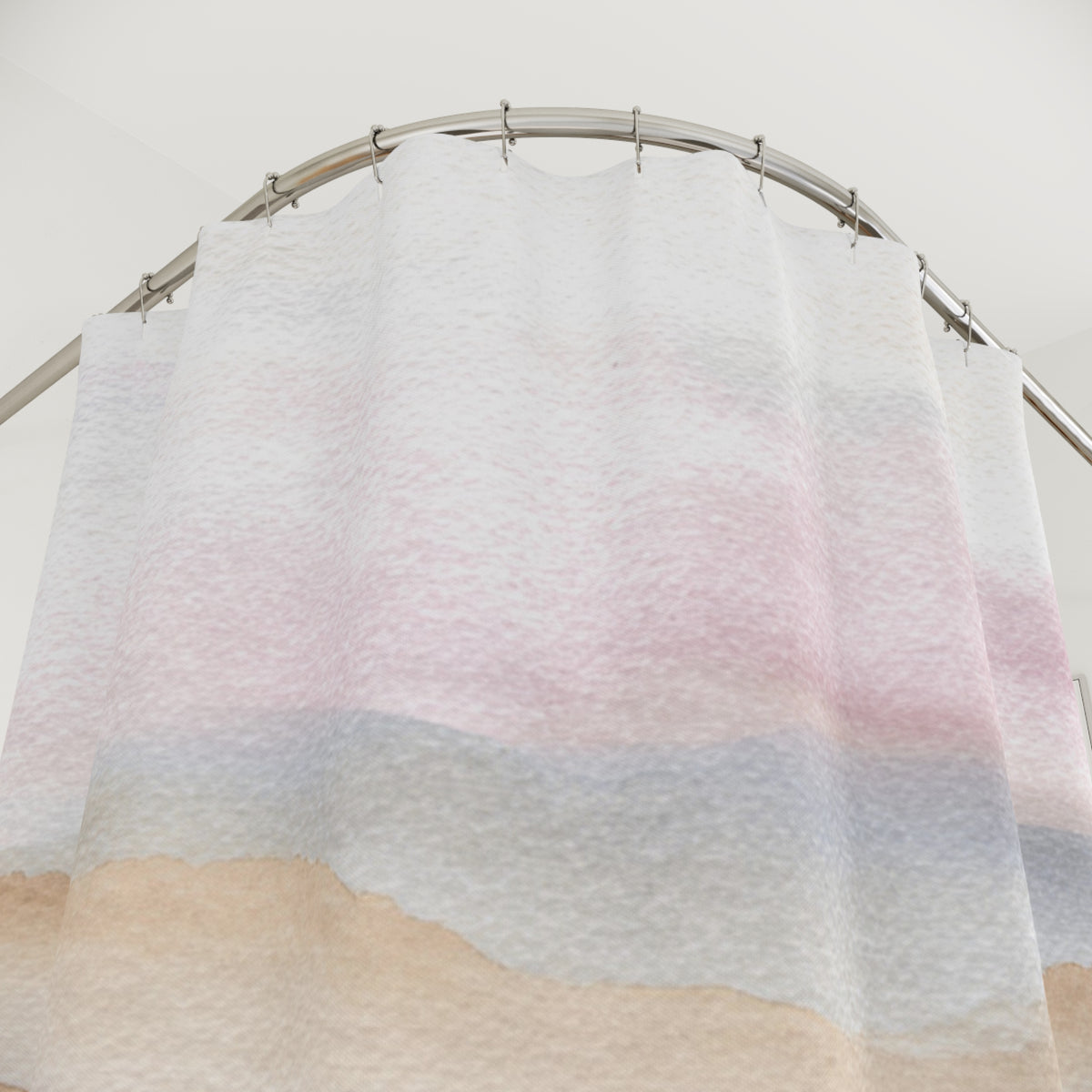 a shower curtain with a watercolor-like pattern of pink, blue, and white colors.