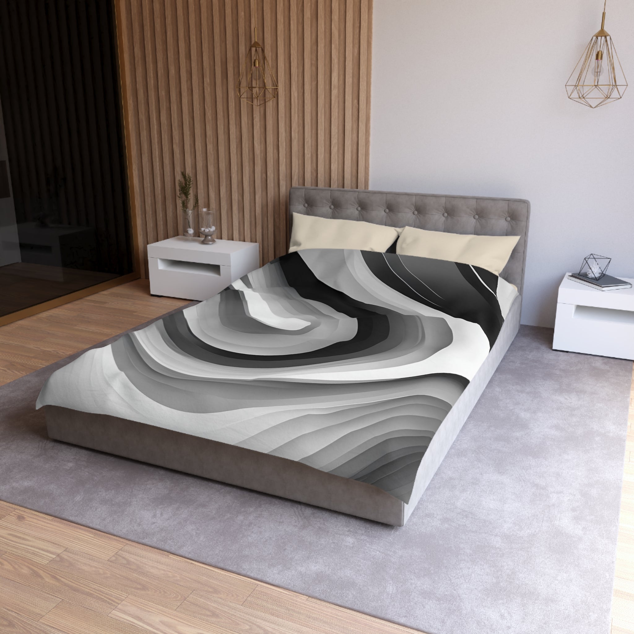a modern bedroom with a gray bedspread and a wooden headboard. The room has a minimalist design with white walls and a gray carpet.