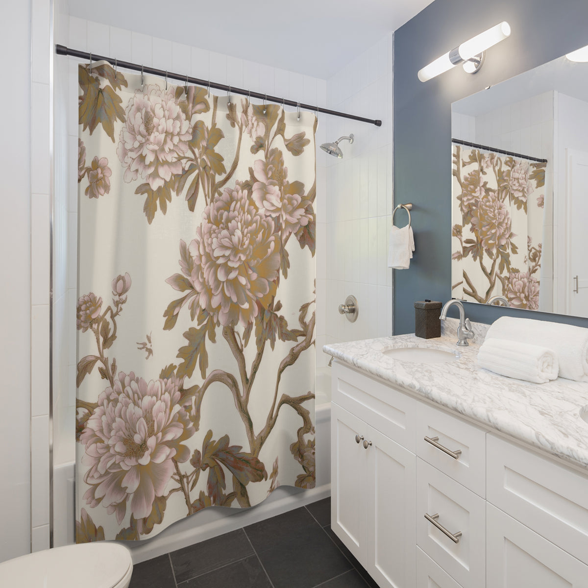 a bathroom with a white vanity, a shower curtain with a floral pattern, and a mirror above the vanity.