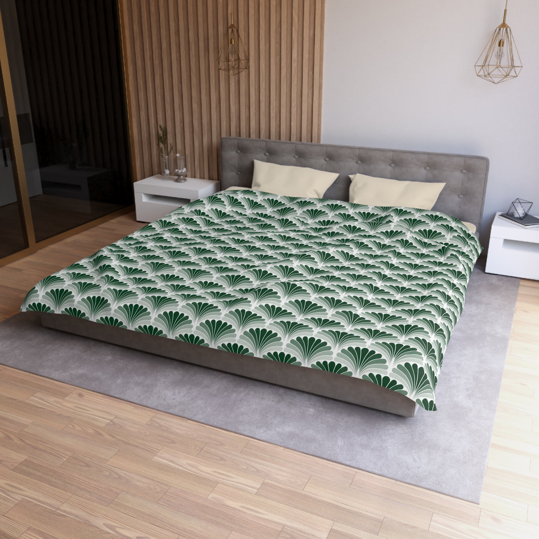 a modern bedroom with a large bed, a gray headboard, and a green and white patterned comforter. The room has a wooden floor and white walls, creating a clean and minimalist aesthetic.