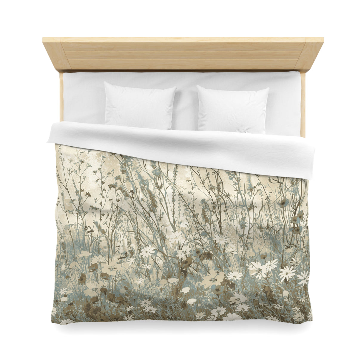 a neatly made bed with a floral print comforter and pillows.