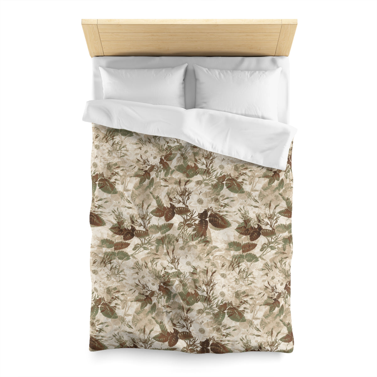a bed with a floral print comforter and pillows.