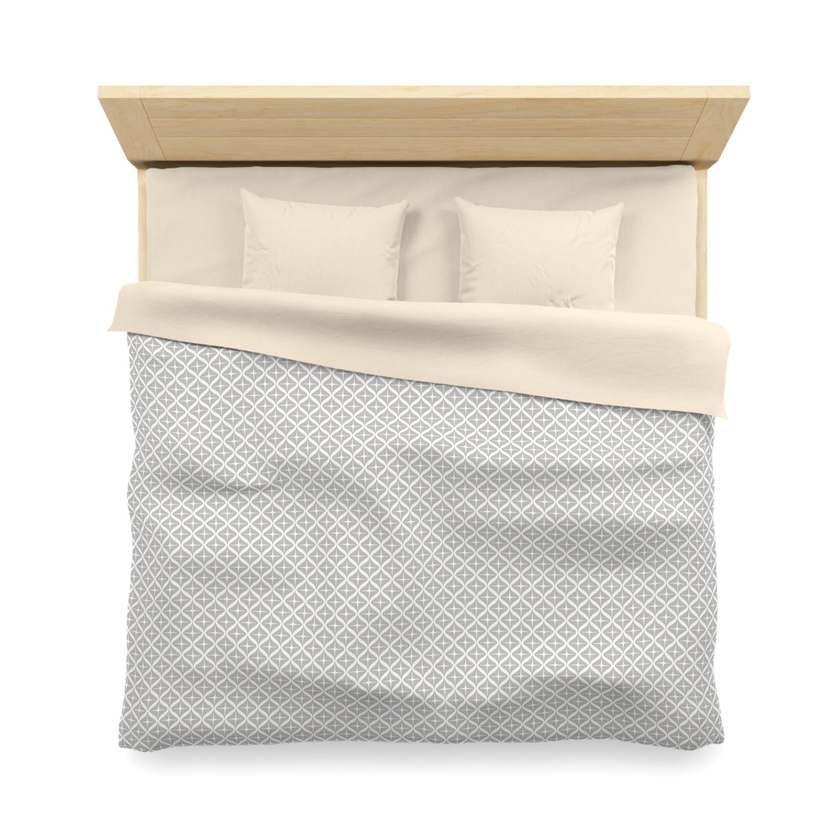 A neatly made bed with a gray and white patterned comforter and two pillows.