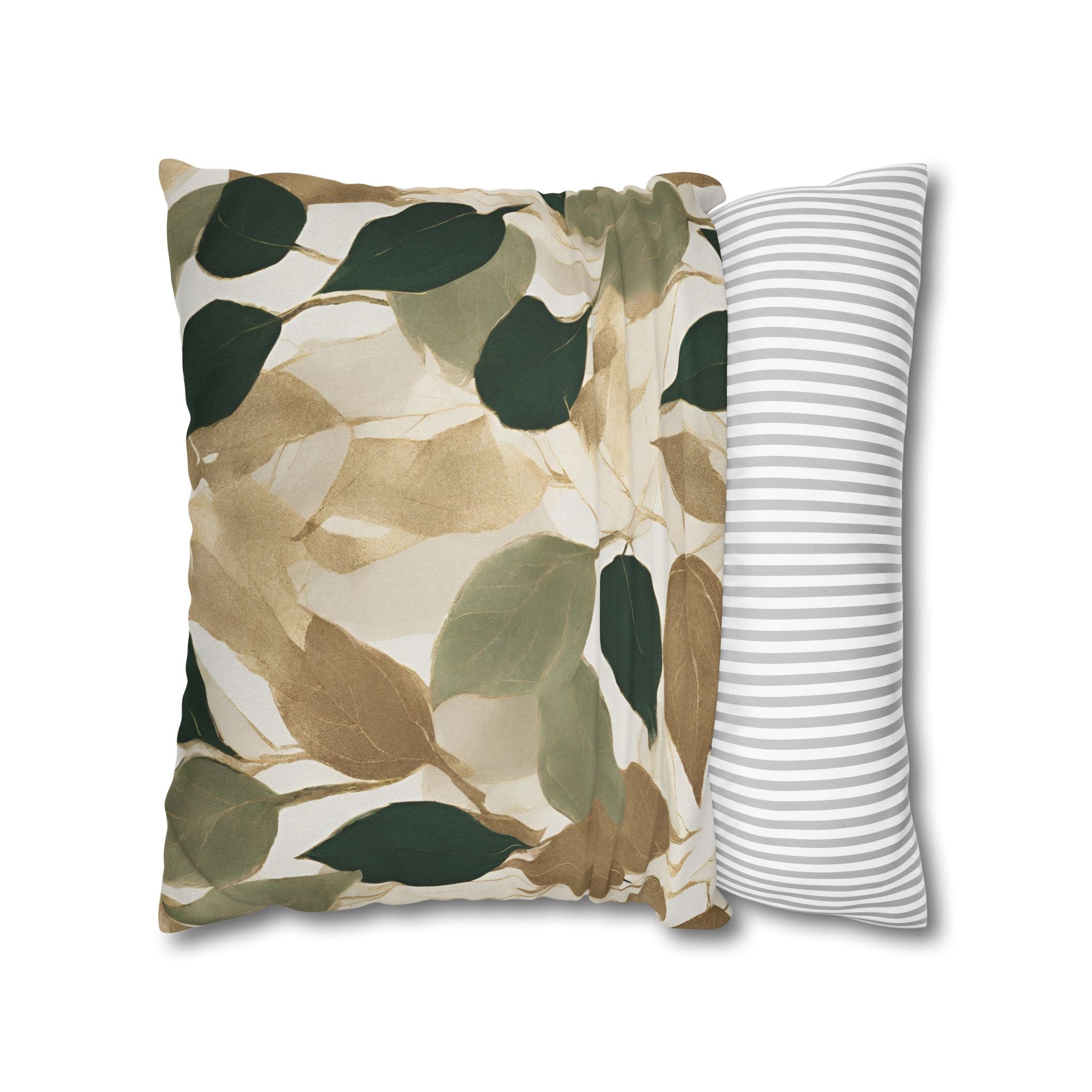 a decorative pillow with a leaf pattern in shades of green and brown.