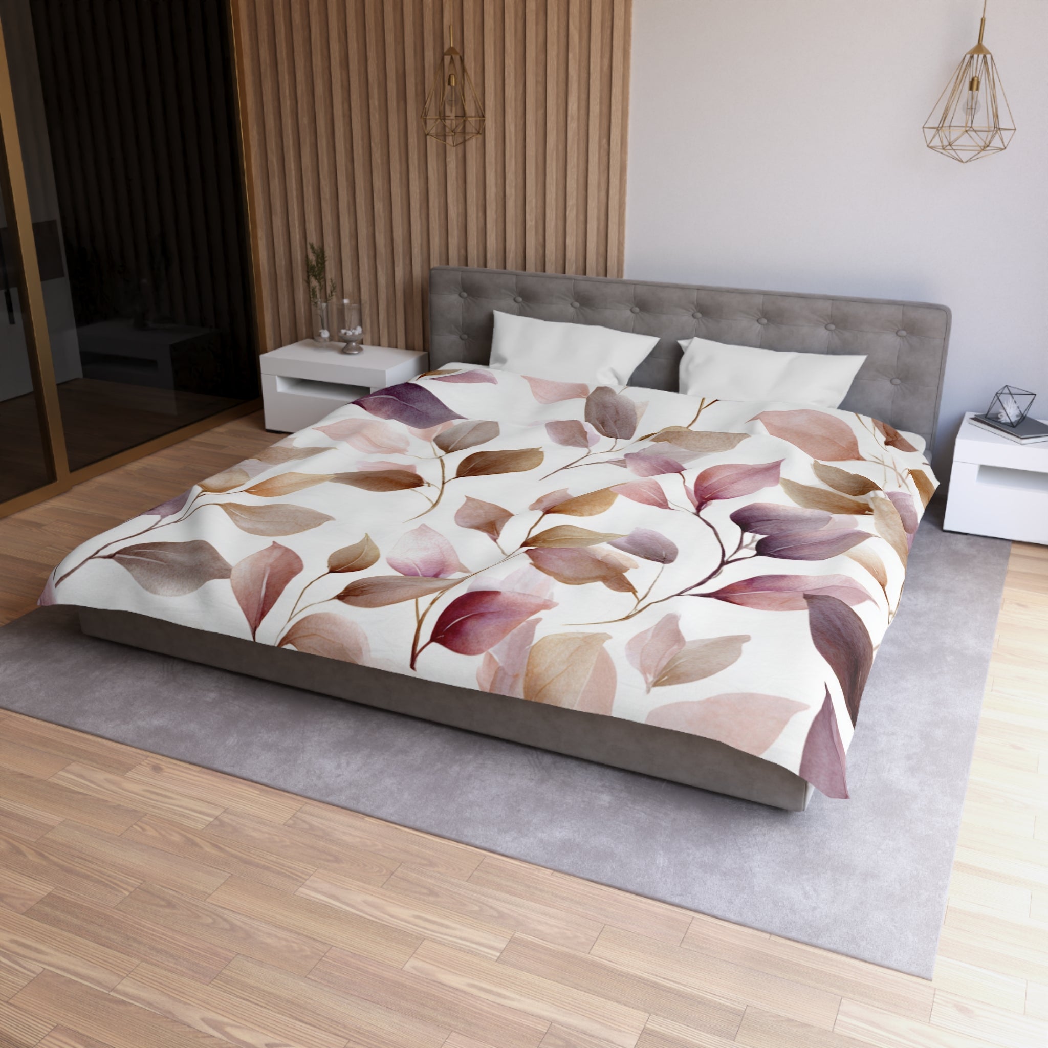 a modern bedroom with a large bed featuring a floral print comforter and pillows. The bed is positioned against a wall with a wooden panel design. The room has a minimalist and clean aesthetic, with a gray headboard and white nightstands.