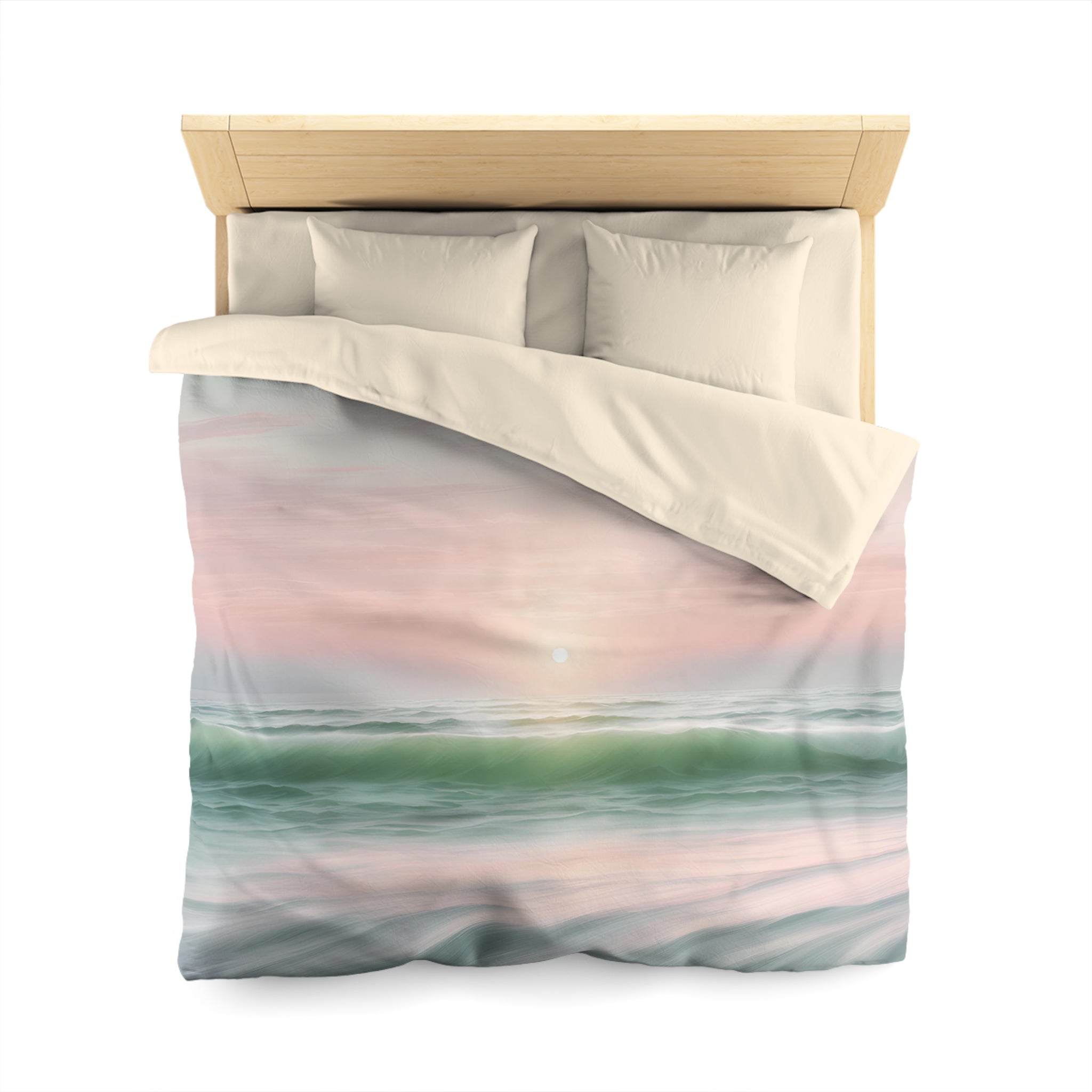 a bed with a colorful, nature-inspired comforter featuring a sunset over the ocean.
