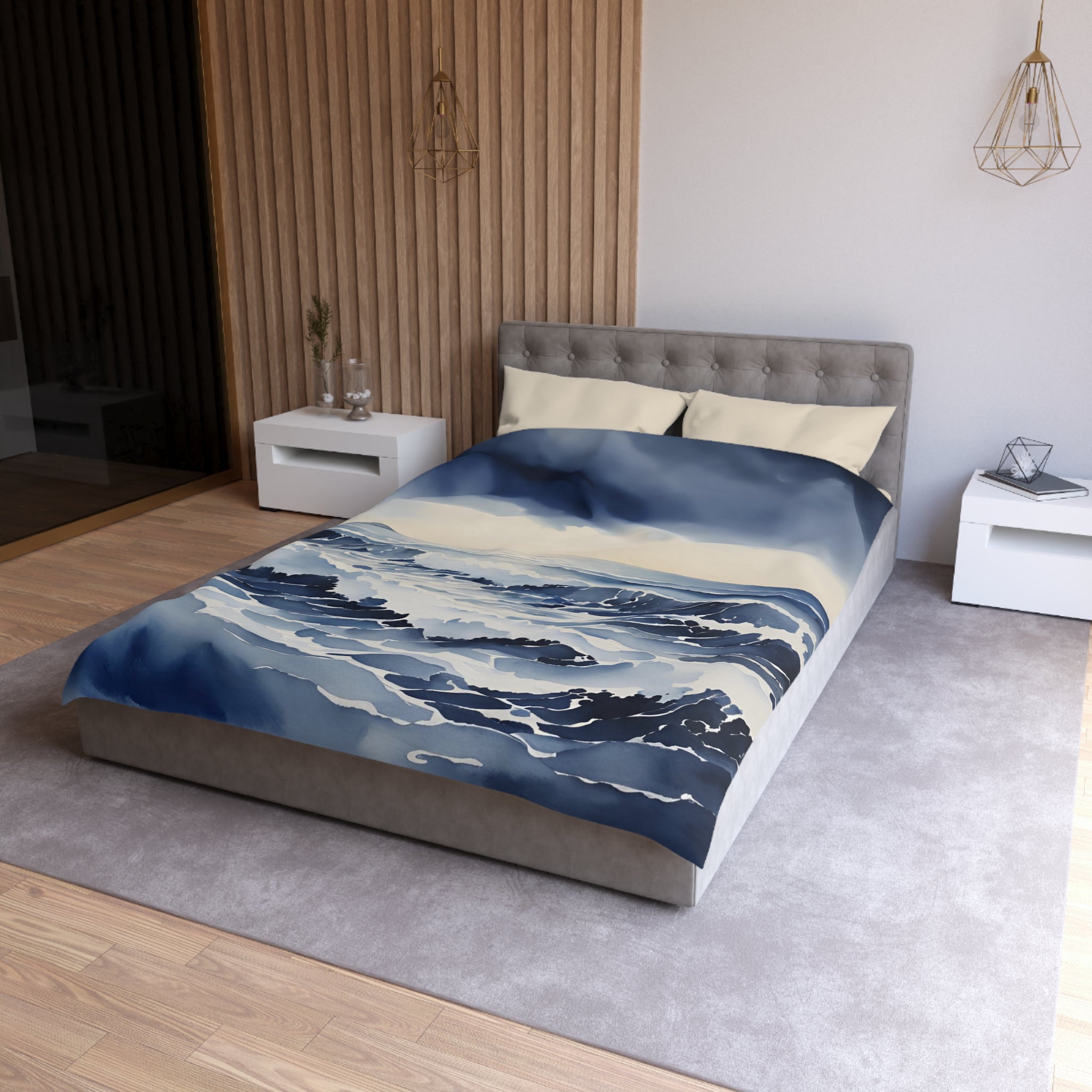 a modern bedroom with a large bed, a nightstand, and a wooden wall. The bed has a blue and white ocean-themed comforter, and the room has a neutral color scheme with a gray carpet and white walls.