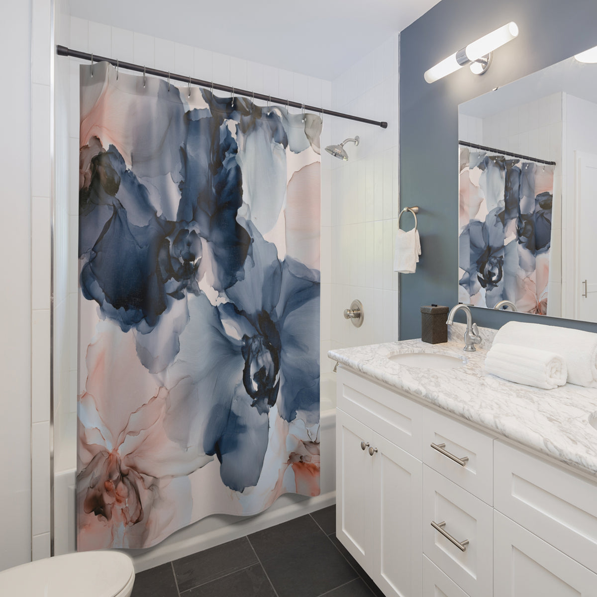 a bathroom with a shower curtain and a sink