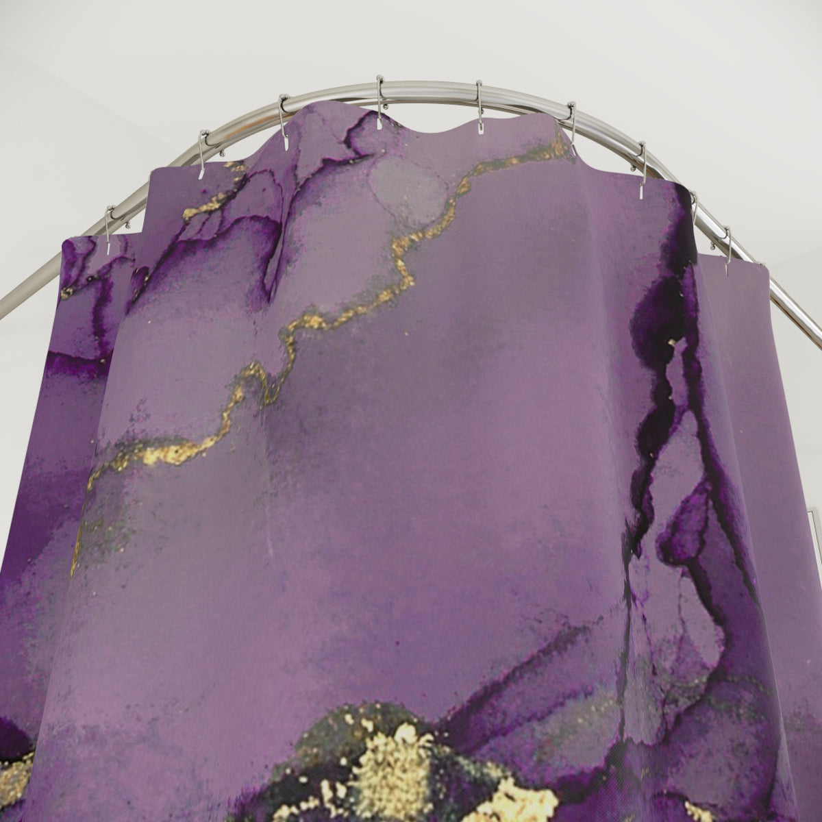 a purple shower curtain with a marble-like pattern, hanging from a rod.