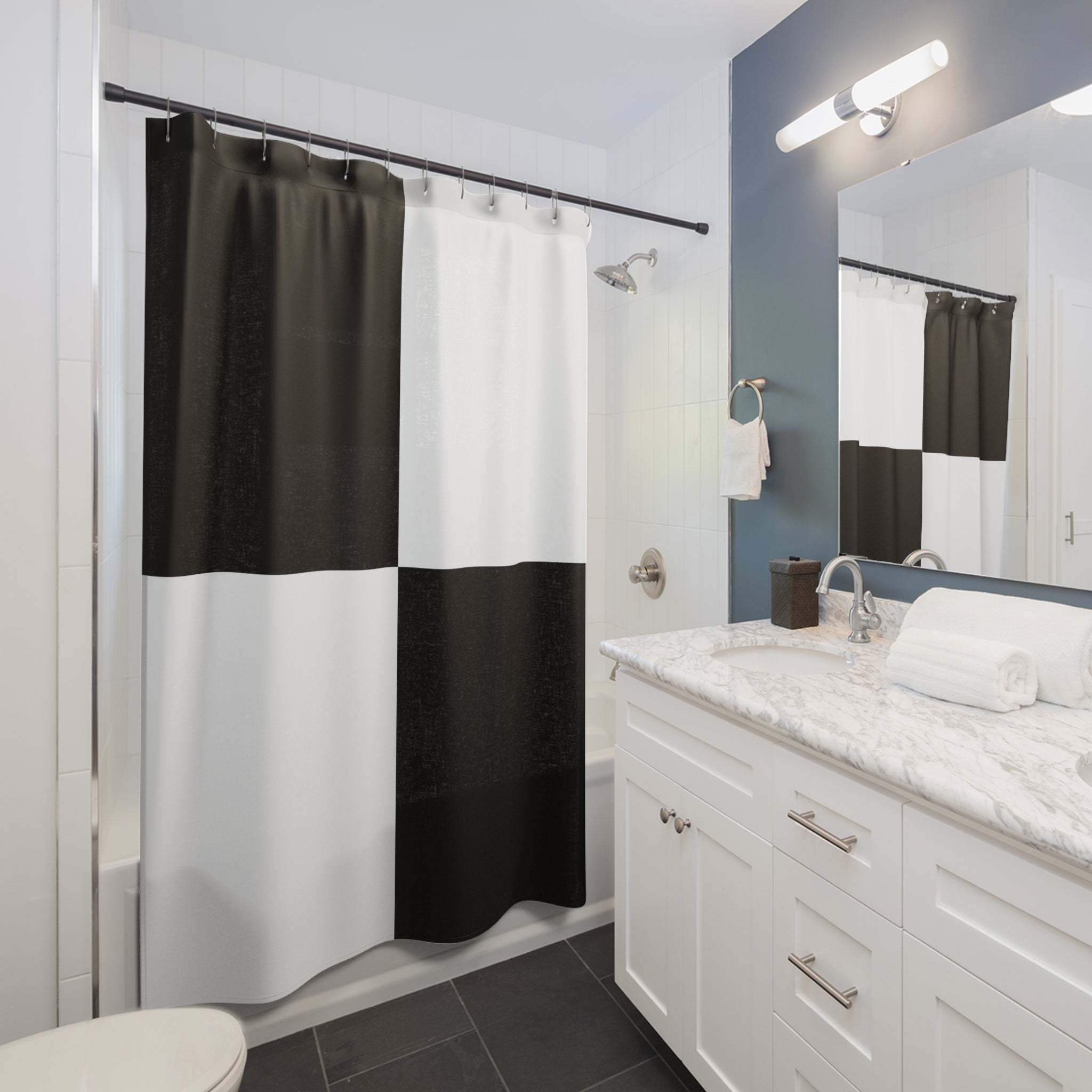 a bathroom with a black and white shower curtain