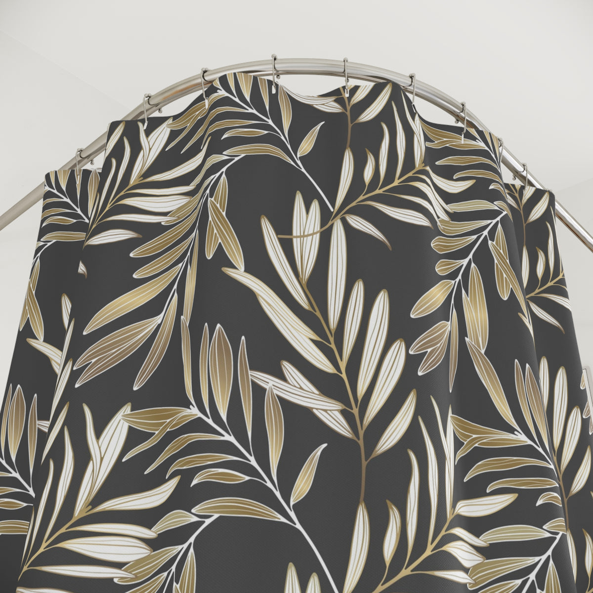 a black and gold leafy pattern on a shower curtain.