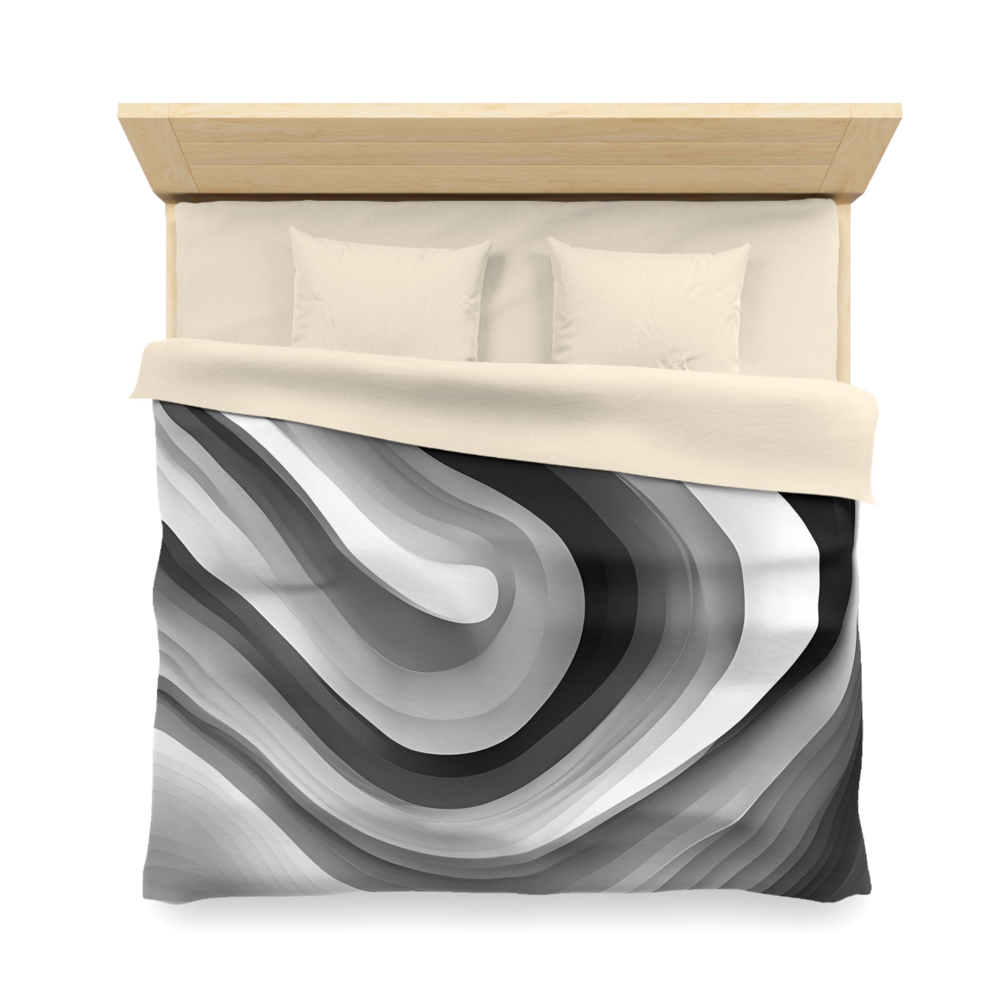 a neatly made bed with a black and white abstract patterned comforter.