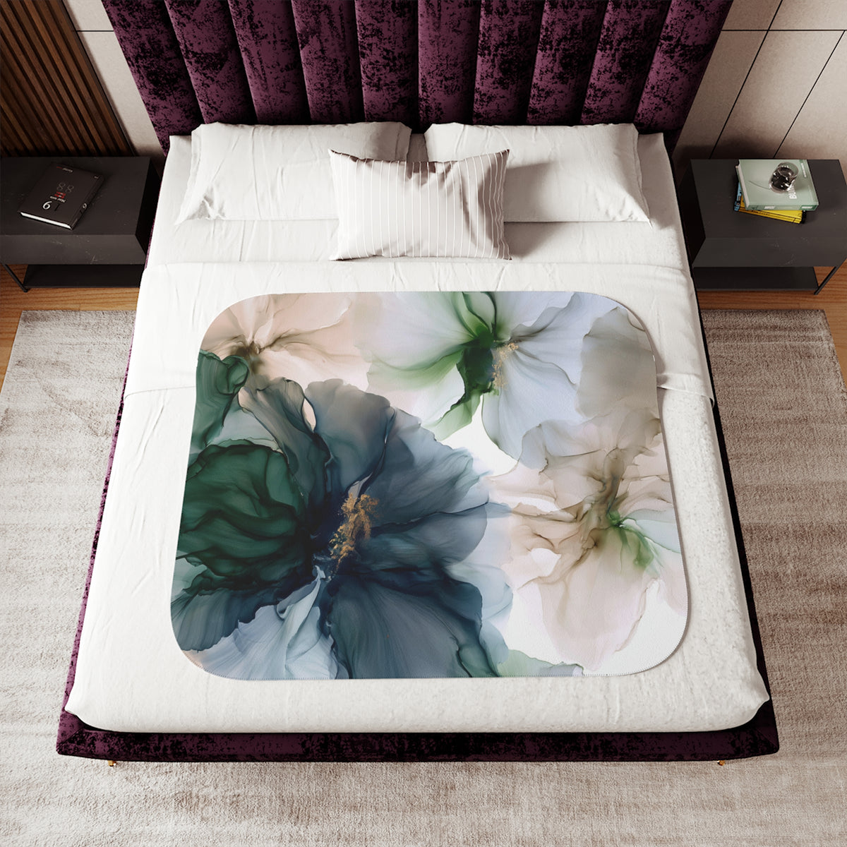 a bed with a floral comforter and pillows