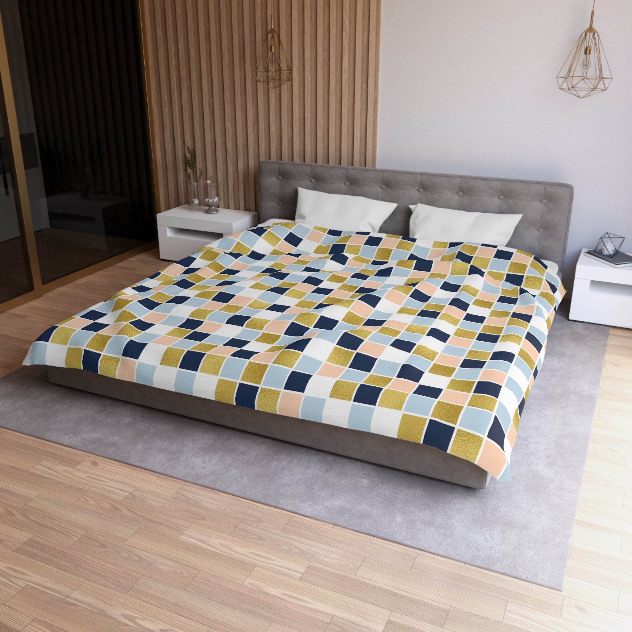 a modern bedroom with a large bed, a gray headboard, and a colorful geometric patterned bedspread.
