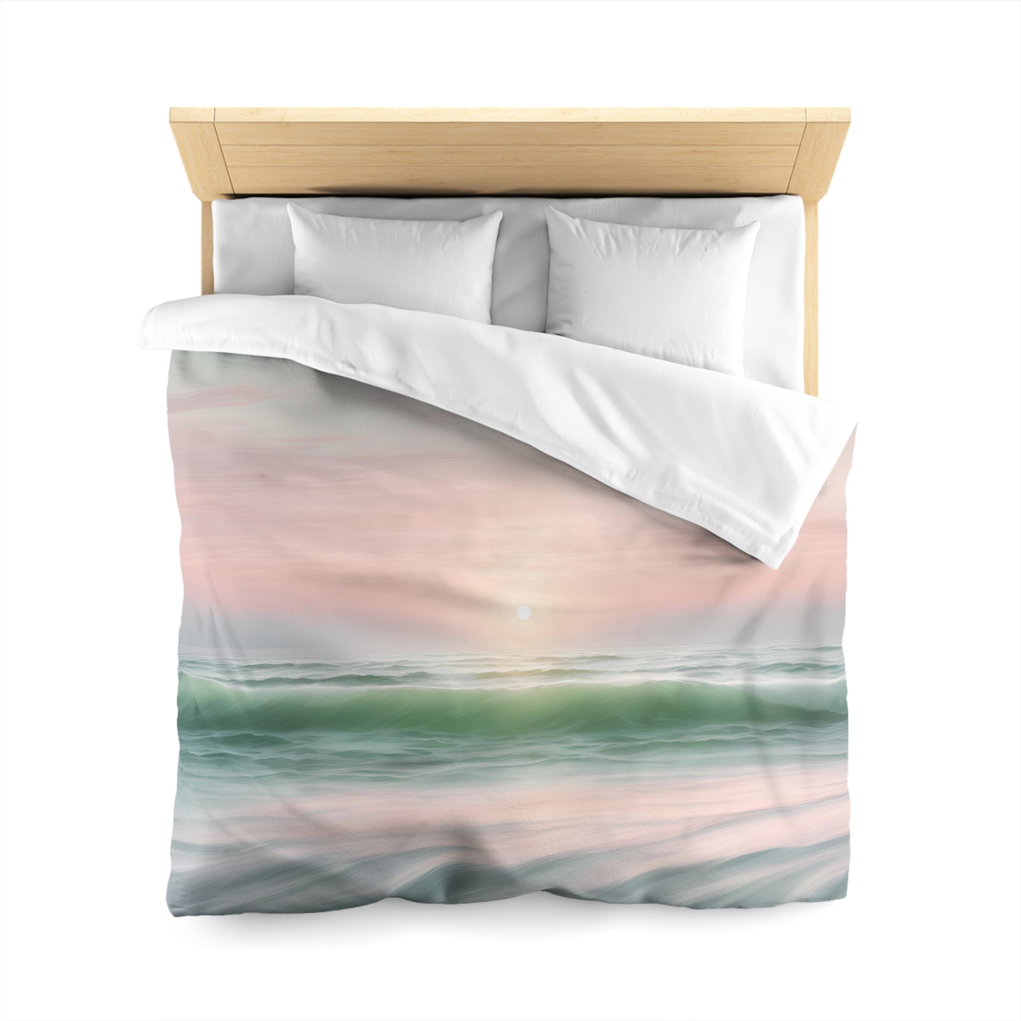 a bed with a white comforter and pillows, featuring a printed design depicting a serene ocean scene with a sunset over the water.