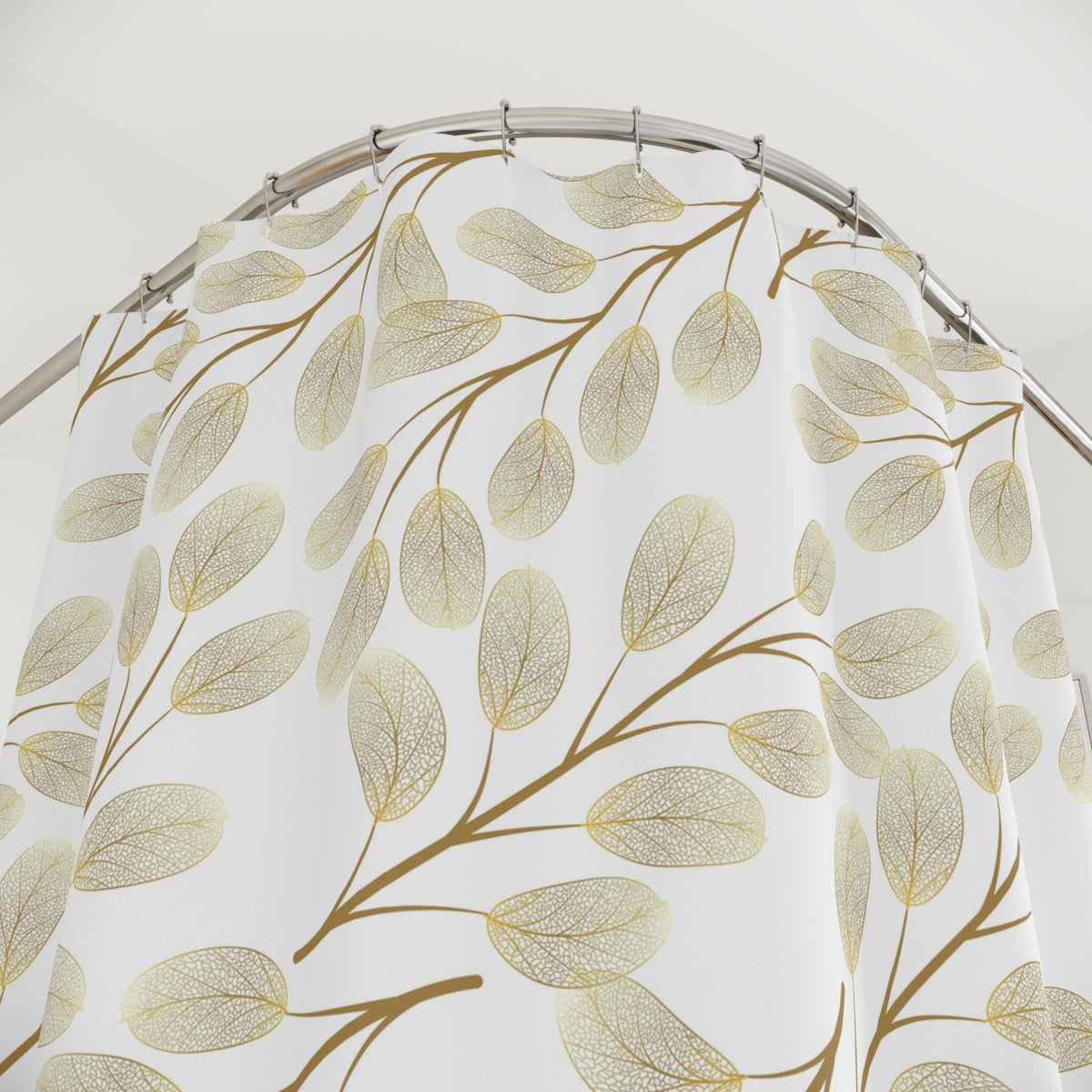 a shower curtain with a gold leaf pattern.