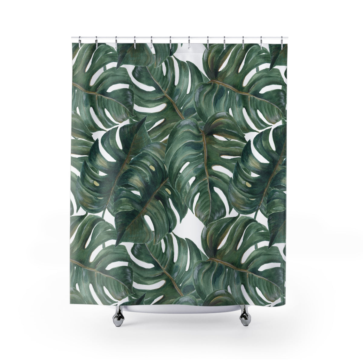 a shower curtain with a repeating pattern of large green leaves, resembling those of a monstera plant.