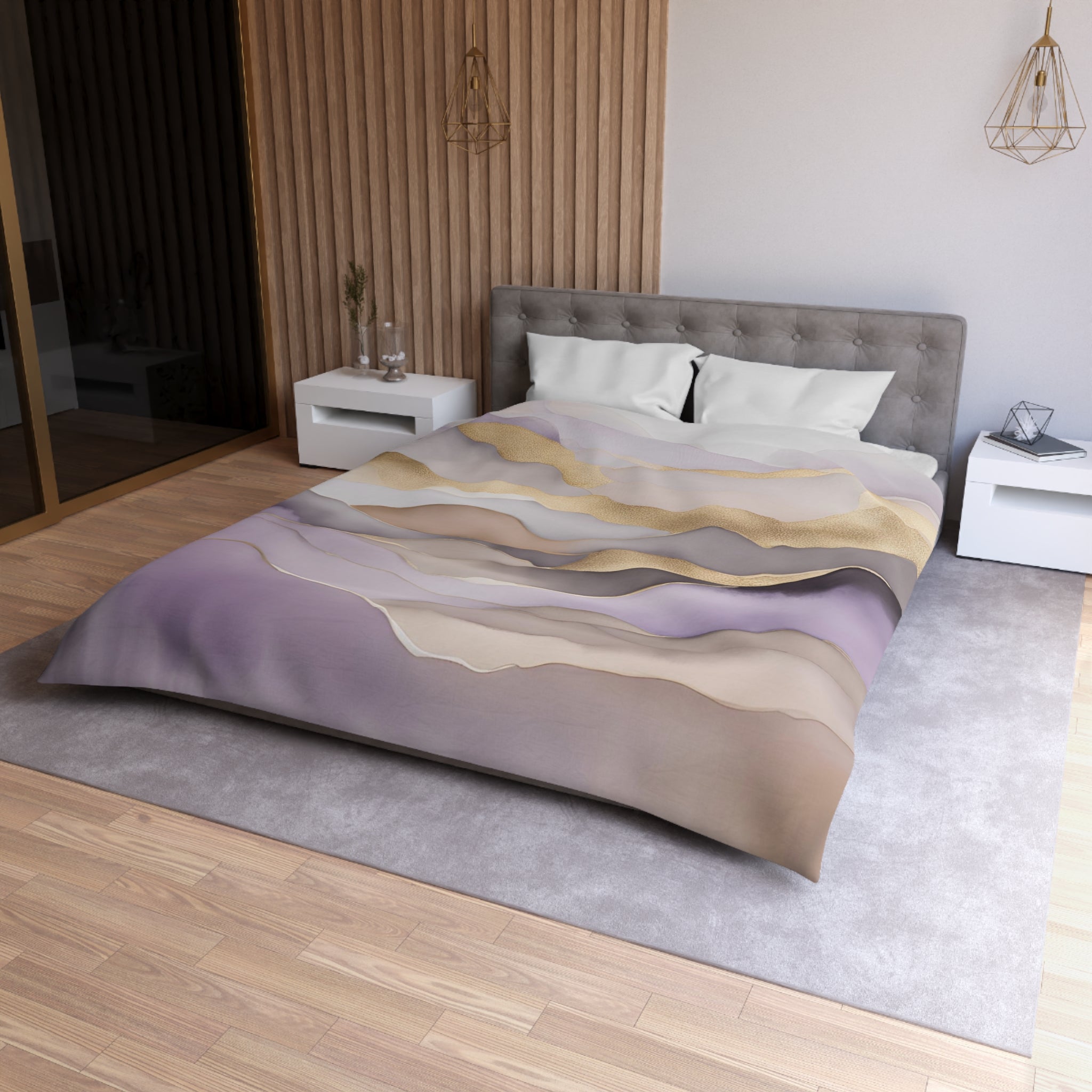 a modern bedroom with a large bed, a gray headboard, and a colorful patterned comforter. The room has a wooden floor and white nightstands on either side of the bed. There is also a rug on the floor, adding to the overall aesthetic of the space.
