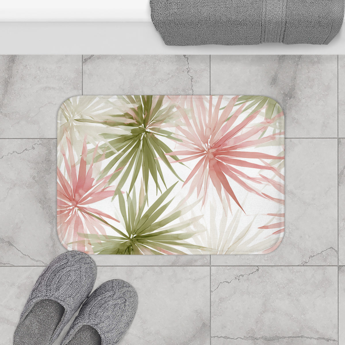 a bathroom scene with a colorful bath mat, gray bath slippers, and a towel.