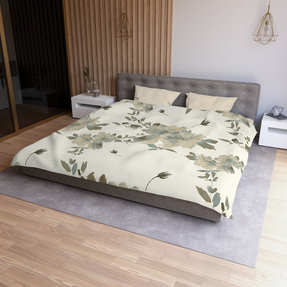 a modern bedroom with a large bed, a gray headboard, and a floral print bedspread. The room has a wooden floor and white walls, creating a serene and elegant atmosphere.